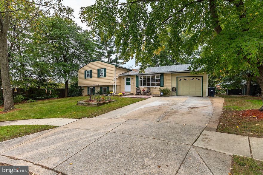 Spacious 4-level split level in excellent condition - new electric to house/garage, new furnace, 2yr old roof/hot water heater.  5BR, 3 full baths - tax living area incorrect it is 2300+  sq.ft. Hardwoods thruout upper lvls.  FR woodstove w/spanish tile flooring. Eat-in KT & sep DR. Cul-de-sac lot, fenced back yard.Great location - easy access o park, schools, library, metro bus, MARC train & ICC.