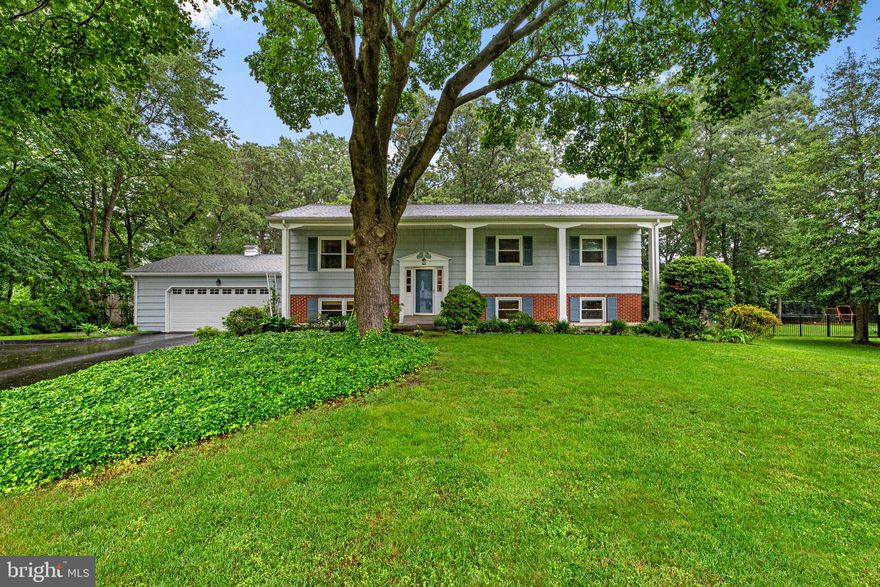 Welcome to 127 Drexel Drive – Where Space, Style, and Location Meet. Step into this beautifully updated 5-bedroom, 3-bath home, with over 2,500 square feet of finished space, ideally situated on over half an acre in a peaceful, sought-after neighborhood. Thoughtfully designed for modern living, this spacious residence offers comfort, functionality, and timeless elegance throughout. Upstairs, gleaming hardwood floors guide you through a seamless open-concept layout that connects the inviting living room, sunlit dining area, and the stylishly renovated kitchen. The kitchen is a chef’s dream with quartz countertops, stainless steel appliances, and cabinetry that adds both charm and practicality. The expansive primary suite is your private retreat, featuring a renovated en-suite bathroom and ample closet space. Two additional bedrooms and a beautifully updated full hall bath complete the upper level. Downstairs, discover a bright and airy walk-out lower level, perfect for entertaining or unwinding. Enjoy a cozy living room with fireplace, built-in wet bar, and luxury vinyl plank flooring throughout. Two more generously sized bedrooms, a third full bath, and a functional mudroom provide flexible living options for guests, home offices, or multigenerational living. 
Outside, the fully fenced backyard offers room to relax, entertain, or garden. Whether dining al fresco on the screened-in back porch, unwinding on the large front porch, or hosting summer gatherings on the patio, this outdoor space was made for making memories. Additional highlights include an oversized 2-car attached garage, mature landscaping, and a prime location just a short walk to Kinder Farm Park and biking distance to the B&A Trail. Convenient to the Chartwell Golf & Country Club and St. Andrew's Swim & Tennis Club (memberships required), with easy access to major commuter routes, shopping, and dining. Zoned for highly regarded Severna Park Blue Ribbon public schools. Don’t miss your chance to tour this exceptional home — schedule your private showing today!