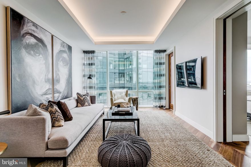 Welcome to the Four Seasons Private Residences in the heart of Baltimore’s Harbor East, where luxury, location, and lifestyle converge. From the 21st floor, this gorgeous 1-bedroom, 1.5-bathroom residence offers spectacular views of the city skyline and harbor through floor-to-ceiling windows. This refined residence features rich walnut herringbone flooring and high-end finishes throughout. In the kitchen elegant cabinetry, a gas stove, built in microwave, and elegant quartz countertops create a warm space for cooking for family and friends. The primary suite includes a walk-in closet and a luxurious marble bathroom with double sinks and walk-in separate shower.  As a rental resident in the Four Seasons, you’ll have exclusive access to the private 28th-floor amenity level featuring an indoor saltwater infinity pool, sauna, outdoor deck, fitness center, meeting rooms, and lounging areas — plus a dog-walking area for your furry family members. You’ll also enjoy full access to all hotel amenities, including the outdoor pool, large fitness center, and valet services. There are four on-site restaurants in the Four Seasons, and many amazing dining options just a short walk away in Harbor East and Fells Point. Shopping, parks, harbor activities, museums, and miles scenic waterfront walkways are all close enough to enjoy every day. Experience luxury living at the Four Seasons, it’s more than a residence, it’s a lifestyle.   One assigned garage parking space is included. This property is also for sale.