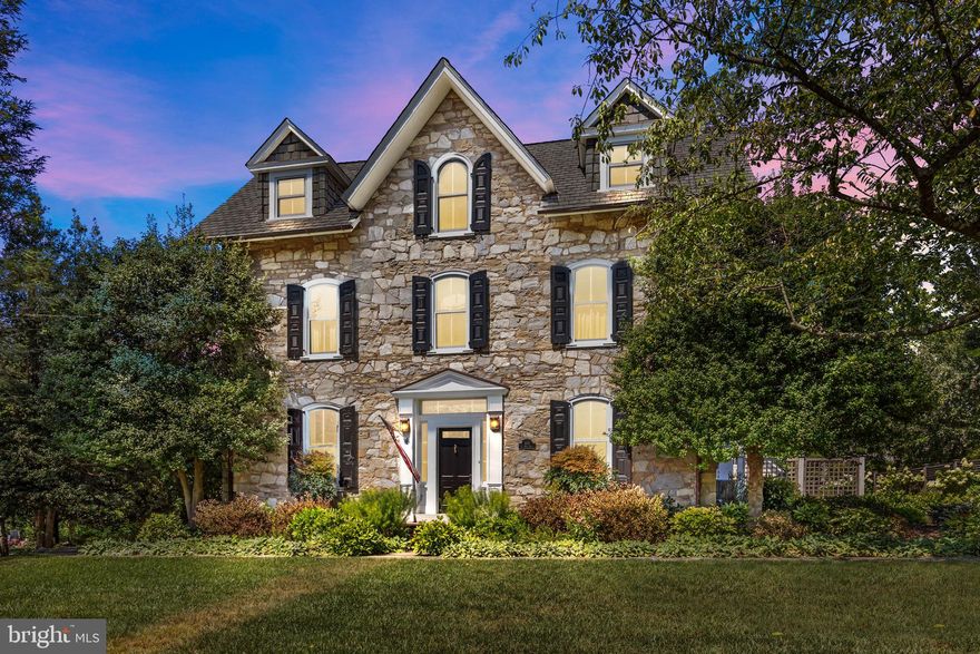 OPEN HOUSE CANCELED _ Step into timeless elegance with this early 1800’s 3-story Country Victorian, beautifully updated and lovingly maintained, offering over 5,000 sq. ft. of living space on nearly an acre. Blending classic charm with modern updates, this stone-front residence invites you to move right in and create lasting memories within the desirable village of Flourtown, PA. Inside, pride of ownership shines through every detail. The home boasts 6 bedrooms, 3.5 baths, and four fireplaces—three natural gas and one wood-burning, with 10-foot ceilings and newly replaced Marvin and Kolbe windows, floods the home with natural light throughout. The first floor features a formal dining room and spacious living room, both accented with crown molding, wainscoting, and natural hardwood floors. A family room addition showcases a striking natural stone wall that extends to the second-floor owner’s suite. The 2-inch-thick pine flooring flows into the gourmet kitchen, designed to impress with soapstone countertops, a farmhouse sink, center butcher block island, cabinet lighting, Dacor refrigerator, double oven, and a 6-burner gas range with hood—perfect for both daily living and entertaining. The thoughtfully designed owner’s suite, added in the early 2000s, offers a private retreat with a sitting area accented by the natural stone wall, a spa-like bath with radiant floor heating, marble dual vanities, a stall shower, and a separate soaking tub for evening relaxation. A walk-in closet and convenient laundry room are also included within the suite. Two additional spacious bedrooms and a shared hall bath complete this level. The third-floor features three more generously sized bedrooms and a hall bath. Recent upgrades ensure peace of mind and comfort, including a custom-built boilers replaced in 2023. Outdoors, enjoy a bluestone patio framed by a stone retaining wall that wraps around to the side of the home, manicured landscaping, a detached two-car garage with loft space and running water, plus a garden shed for additional storage. Conveniently located near major roadways, shopping, and local eateries, this one-of-a-kind property combines historic character with modern comfort—a rare find ready to welcome its next chapter.