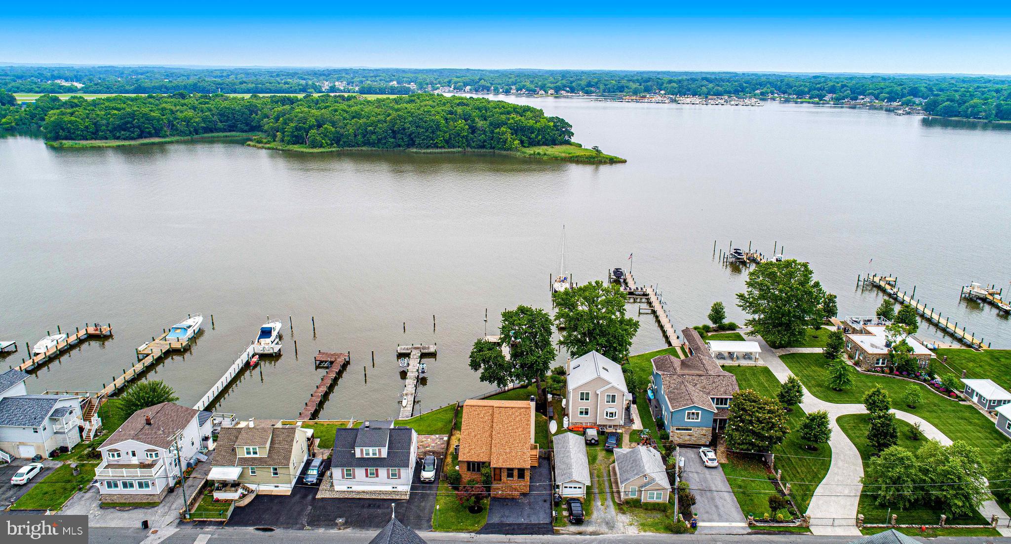 Water Views Water Views. This waterfront home has a private dock and long peir. Large rear deck overlooking your yard. Large Family room with fireplace with floor to ceiling windows and sliding door,. Perfect for entertaining. Very unique 4 bedroom and 3 bath home with wood floors throughout the first and second floor. Primary suite with private balcony overlooking the water.