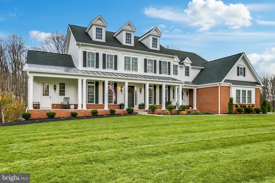 Classic center-hall colonial on fantastic homesite in Toll Brother's recently completed community, Weatherstone.  The 3.75 acre lot backs to woods with cleared paths prefect for hiking and mountain biking.  The exterior of the home is composed of Hardiplank, brick to grade, and a full-length, flagstone patio.  The attached, five-car garage includes storage areas, custom flooring and built-in cabinetry. The traditional interior features front and rear home offices, formal dining and butler's pantry. The chef's kitchen includes wall ovens, a 6-burner gas stove with griddle, built-in refrigerator, massive quartz island and handsome, white cabinetry.  The mud room area off of the kitchen features a walk-in pantry, powder room, and custom, built-in cubbies.  The kitchen opens to the family room with a gas fireplace.  Through a fully retractable glass sliding door is a screened-in outdoor living area with a gas stove and flagstone flooring.  The main level also includes an in-law/au pair suite with a full bath, walk-in closet, kitchenette, and living area with access to the front porch. Upstairs is a light-filled loft area, laundry, and four bedrooms.  The owner's suite includes a sitting area and two walk-in closets.  The master bath has a frameless, dual head shower, double vanities, and a stand alone soaking tub.  The basement features 9' ceilings, recessed lighting, and tons of additional unfinished storage space.  Custom drapery, built-ins, plantation shutters, and lighting throughout.