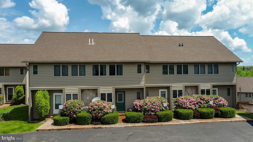 Welcome to your four-season retreat at Deep Creek Lake! Perfectly positioned in the highly desirable Deep Creek Village community, this beautifully updated lakefront townhome offers the rare combination of lake access and walkability to Wisp Resort’s ski lodge and ski lifts. Whether you're seeking a year-round getaway, investment property, or full-time mountain-lake lifestyle, this home delivers the best of Deep Creek living in every season.

Recently refreshed by the owners, the townhome features new flooring, updated furnishings, new TVs, fresh interior paint, and new toilets throughout. Adding even more value, this is the newer and larger floor plan offering additional square footage and enhanced living space.

The main level welcomes you with an open-concept layout featuring a spacious kitchen, dining area, convenient half bath, and cozy living room anchored by a stunning stone fireplace. Step outside onto the deck to enjoy filtered lake views and the peaceful mountain setting.

The lower level offers incredible flexibility with an additional bedroom/family room space, full bathroom, and walk-out access to the lower patio complete with a private hot tub and hanging kayak storage — perfect after a day on the slopes or the lake.

Upstairs, you'll find two generously sized bedrooms, each with its own private ensuite bathroom. One bedroom overlooks the lake and features a private balcony, while the other captures beautiful views of Wisp Resort and the ski slopes.

Deep Creek Village is one of the area’s most sought-after communities, located directly across from the entrance to Wisp Resort. Community amenities include a private lake access area tucked into a quiet cove, community dock with rotating boat slip availability during boating season thru the condo association, canoe/kayak storage by the lake, tennis court, and assigned parking.

Enjoy skiing, boating, hiking, golf, dining, and all the adventures Deep Creek Lake has to offer — all just steps from your front door!