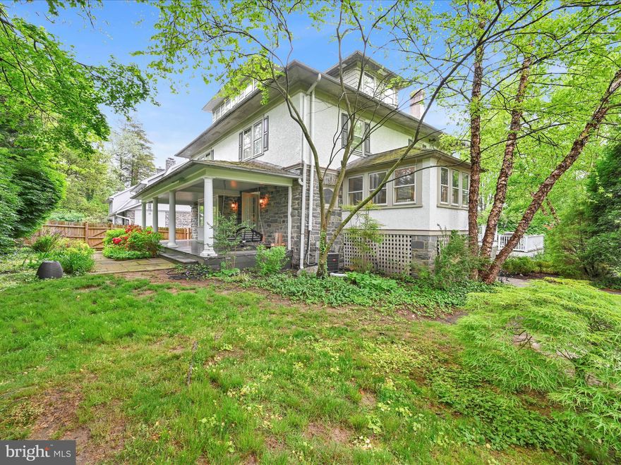 Located in highly desirable Narberth on an extra-large lot!   Step into this extraordinary residence, seamlessly blending age-old character with contemporary luxury. The one of a kind mudroom, adorned with exquisite wainscoting and custom cabinetry, greets you with warmth and sophistication, complemented by a chic powder room. From here, enter an expansive kitchen featuring a stunning marble-topped island, perfect for both culinary creations and casual gatherings.   Top-of-the-line appliances—including a Bosch dishwasher, KitchenAid refrigerator, and Fisher & Paykel range—ensure every modern convenience is at your fingertips.  A dedicated walk-in pantry offers ample storage for all your culinary essentials.   Adjacent to the kitchen, a generous dining room with a commanding window seat invites memorable meals and conversations.   An elegant glass cabinet with original leaded-glass doors showcases cherished treasures.   The oak pocket doors open to a Grand living room, where a coffered ceiling and a stone fireplace create an inviting ambiance.  Beautiful stained-glass windows and leaded-glass cabinetry add exquisite detail and craftsmanship.   Ascend to the second floor, where a cozy mezzanine sitting area, enveloped by three walls of windows, offers a tranquil retreat. The second floor boasts a spacious hallway leading to four generously proportioned  bedrooms—two featuring charming window seats—along with an updated hall bath complete with a double vanity and a large shower.   The third floor reveals two additional spacious bedrooms, attic storage, and an elegant hall bath featuring a romantic clawfoot tub—perfect for unwinding in style.    The walkout basement is a bright, cheerful space ideal for children's play or entertaining—it includes dedicated storage and a woodworking shop for artisans and hobbyists alike.
Outside, a beautiful Ipe wood deck overlooks a private landscaped yard—an idyllic setting for outdoor entertaining and relaxation. A service driveway off Montgomery Avenue leads to a two-car garage (currently used for storage), and an additional driveway off N. Essex Avenue provides daily parking.

This exceptional home (once the clubhouse for a tennis club, according to historical maps), distinguished by large rooms, soaring ceilings, and elegant moldings, offers a harmonious blend of historic charm and modern comfort.  Located within the coveted Lower Merion School District and within walking distance to local amenities, this home truly is a rare find—an enduring treasure in a highly sought-after locale.