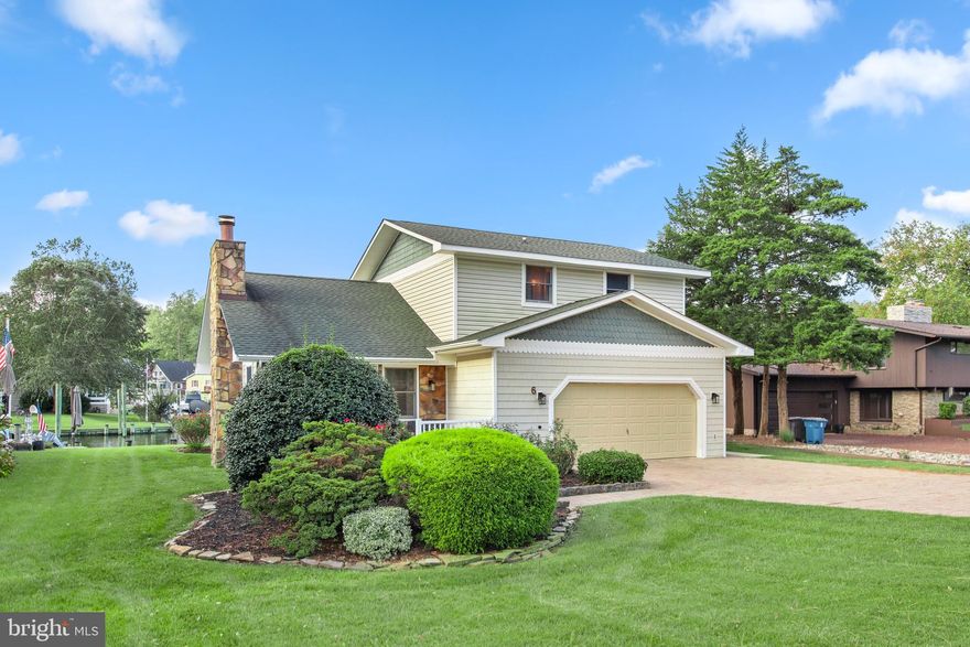 Back on the market. Situated on a coveted canal-front cul-de-sac! This home is located on a bulkheaded lot with a
dock, overlooking a wide area of the canal with easy boating access to the St. Martin's River.  Experience life in Ocean Pines — an award-winning community packed with amenities. Enjoy swimming pools, an 18-hole championship golf course, tennis and pickleball courts, a Yacht Club, Beach Club, Recreation Center, Farmer's Market Saturdays, short drive to Ocean City...AND MORE! A meticulously maintained home with a main level bedroom and bath, three bedrooms on the upper level, newly painted and cleaned carpet, this home is READY FOR MOVE-IN! Whether you're looking for a vacation home, primary residence or investment property, this is one to see!  Property being sold as-is, inspections for informational purposes only.