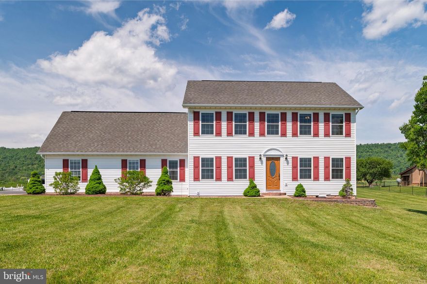 Located among the scenic apple orchards and rolling farmland west of Martinsburg, WV, this charming colonial-style home sits on a 1.24-acre lot and offers incredible panoramic views with North Mountain serving as a stunning backdrop. This property is not in a subdivision and has no HOA! The current owner has completed numerous renovations over the past several years including having a new heat pump installed, a reverse osmosis system and a bump-out pantry added in the kitchen, new carpet in the living room, new windows for the whole home (except garage), new sliding glass door, new siding on the front of the home, new smoke detectors, a 14x20 shed was added, and the primary bathroom has been completely remodeled. The kitchen is highlighted by the huge island wrapped in stone veneer, stainless steel appliances, and beautiful white cabinets. The expansive primary suite offers a separate sitting/dressing room, a walk-in closet, a fully renovated bathroom with a gorgeous custom-tiled shower, and a private balcony, which is a great place to relax and take in the views. The backyard is perfect for entertaining and features a composite deck with vinyl railing that leads down to a large paver patio and fire pit. The home will be available for viewings beginning Saturday, May 9th. Come see everything this amazing property has to offer!