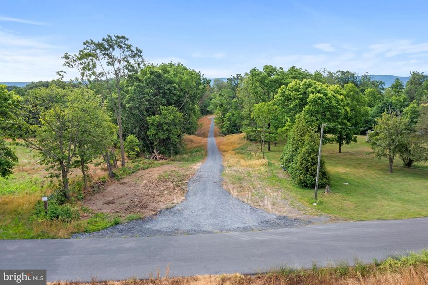 Two  Building Lots!    3.9 acre parcel with road frontage having a 2 bedroom certification letter.  The  3.2 acre parcel has a 3 bedroom certification letter.     Access to the 3.2 acres is via a 40' right of way shared drive with 3.9 acre parcel.   Bordered by farmland with mountain views!  Agricultural zoning applies however the property is unrestricted for a wide variety of building and uses.   Enjoy this country setting just minutes from downtown Woodstock and it's amenities.   Paved state road.   Additional information in Agent Remarks.  Parcel has been recently cleared and ready for building your dream home!