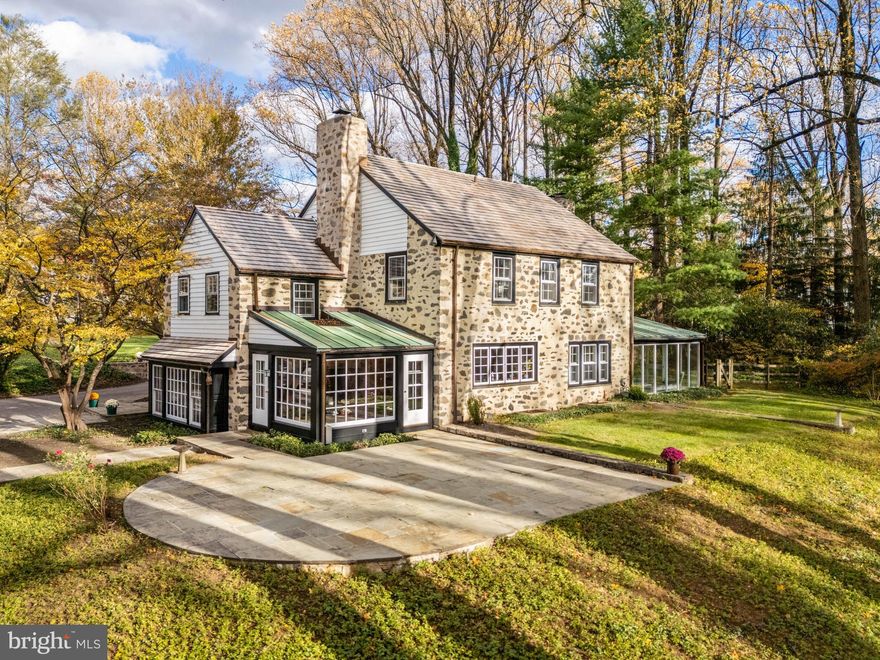 Simply gorgeous pastoral, year-round views greet you when you reside at 188 Abrahams Lane, a truly special property on nearly two acres in Villanova, Radnor Township.  Perfectly perched upon a hilltop overlooking the storied and historically significant Ardrossan Farm, this renovated Farmhouse home and extensive property provides a rare offering for the most discriminating buyer.  This property is in one of the most coveted settings on the Main Line framed by extraordinary and protected farmland.  The current owner thoughtfully renovated this home to the highest standards with attention to detail at every opportunity.  The elegant and warm interior matches the extraordinary exterior design of the structure and grounds featuring perfectly designed stone hardscaping and natural landscapes, including award-winning daylilies curated by the original owner.  
The entry to this Historic Farmhouse features stately double doors, rich cherry paneling surrounding a woodburning fireplace.  The Main Level provides unique blue stone slate floors in the entry way leading to all living areas; the living room features a fireplace with surround cabinetry, deep set windows, oak floors, and an abundance of light;  French doors open to the sun room overlooking the expansive hillside to the Ardrossan Estate valley with magnificent barn views providing year-round living space with custom, insulated laminated glass walls providing noise and UV protection; a convenient wet bar located between the living and dining room perfect for entertaining;  the dining room, just off the foyer, also overlooks the farm meadow through large windows; the kitchen provides a cook’s desired workspace with historic barn and sunset view; a corner exposure with sundrenched breakfast area completes the kitchen and offers another convenient entrance  just steps to the patio and pool;  a welcoming family room with stunning Farmhouse fireplace with original stone and reclaimed wood mantel, a wood beamed ceiling, and cherry floors complete the Main Level.  A perfectly designed central staircase leads to the Second Level featuring five light-filled bedrooms with beautiful corner exposures. The primary suite runs front-to-back with breathtaking views of the Ardrossan Farm meadow, a full bath w/double vanity, walk-in closet, recessed windows with original tile sills and detailed millwork; the two additional hall bedrooms enjoy Jack & Jill full bath; the fourth bedroom is a full suite w/hallway, an abundance of windows, two closets and full bath; the fifth bedroom, a separate wing, is accessed from additional back staircase allowing for perfect guest accommodations or au pair suite,  w/laundry and a full hall bath to service all bedrooms, if necessary.  The Third Level is unfinished with expansive space easily designed for additional bedroom suite.  
The detached two-bay garage features stone and elegant architectural lines and details that complement the house.  It features exposed stone interior walls, cherry wood ceiling, and recessed lighting.  The finished second floor also has a cherry wood ceiling and recessed lighting, providing a lovely space for home office or studio.
The expansive private grounds provide features to satisfy an active family.  An in-ground pool with sunset backdrop, a large flat, fenced back yard, and sizable dog run area discretely located on the side of the property.  Curved stone walls surround a circular arrival court framing the main entry, and historic streetlamps provide elegant property lighting. 
All discriminating buyers will appreciate the architectural details throughout the home, including solid cherry doors, extensive millwork throughout, brass hardware, sophisticated lighting design, Duratherm windows and other subtleties creating a warm and luxurious living environment.  
This exquisite home/property is nestled among bucolic farmlands just minutes to conveniences- Chanticleer, top-rated schools, shopping, dining, transportation, I-476!