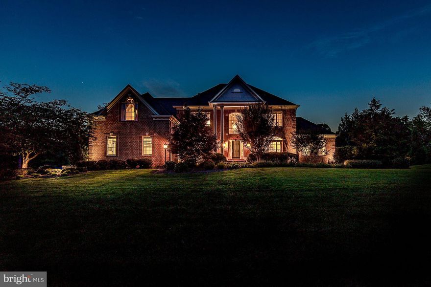 Elegant estate home w/4 BR/4.5 BA, 3 car side-load garage. Open floor plan w/7,238 sq ft. Chef s KIT w/butler s pantry, island & bfast rm. Entertainer's dream w/LR, DR, Office, sunroom, grand foyer. 2 story FR w/ wood FP.  LUX owner s suite w/sitting rm, dual walk-in closets & spa BA. Rec rm, home theater, wet bar, wine cellar & more. Private resort-like1.02 acre lot w/deck, pool, hot tub, patio.