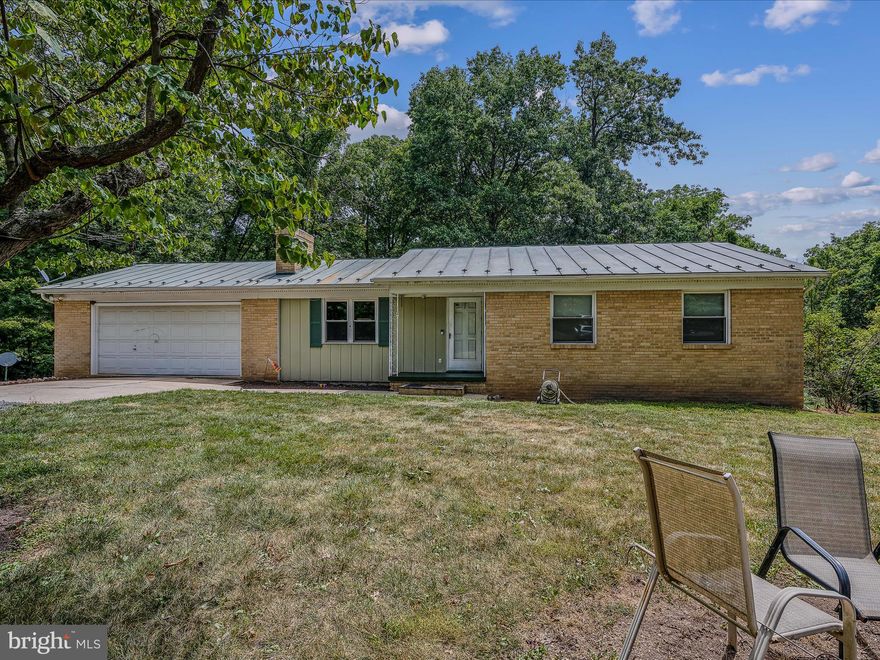 BRICK RANCHER - this 3-bedroom 2.5-bathroom brick rancher on 5 acres located just 6 miles north of Moorefield, WV makes it convenient to everything in town and also Corridor H. This home has a nice private setting, surrounded by trees, even though it sits on US 220. Small stream located at rear of property. With the fully finished basement you have plenty of room to entertain and also has a very nice office/den area with built-in shelving. Basement also has a half bath, laundry room and an additional miscellaneous room. The 12x31ft rear deck also gives you the outside room needed to enjoy your family and friends. Plenty of yard for the kids or pets. Within an hour of Seneca Rocks, Blackwater Falls and several other State and National Forest. Whether you are looking for a starter home or your last home, this one maybe it.