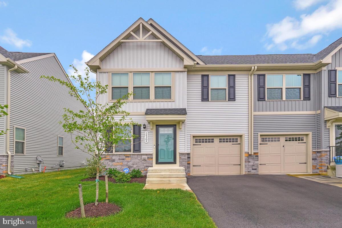 This stunning semi-detached home in the sought-after 55+ community of Timothy Branch combines elegant design, thoughtful layout, and access to incredible amenities—all in a prime location. Step inside to find beautiful LVP flooring flowing throughout the light-filled living room, creating a warm and inviting atmosphere. The gourmet kitchen boasts granite countertops, stainless steel appliances, a stylish ceramic tile backsplash, and an abundance of cabinetry—perfect for cooking and entertaining. The conveniently located main-level primary suite offers a generous walk-in closet and a spa-like en suite bath with dual vanities and a bath/shower combo. A powder room, laundry area, and charming covered porch complete this level for everyday ease. Upstairs, you’ll find two spacious bedrooms and an additional full bath, ideal for guests or hobbies. The partially finished basement features durable epoxy flooring and a versatile rec room with a cozy electric fireplace and built-in shelving. A sleek wet bar with quartz countertops and a wine refrigerator makes entertaining a breeze. Relax in the luxurious full bath with a freestanding tub, and enjoy additional spaces including a den/study/flex room and mechanical/storage room. Enjoy access to a vibrant 55+ lifestyle with a clubhouse, swimming pool, fitness center, pickleball courts, bocce ball court, and a dog park. Stay active and social with nearby Southern Area Aquatics & Recreation Complex (SAARC), offering senior programs like Zumba, yoga, arts & crafts, live music, and community events. Just minutes from restaurants, shopping, and major highways, you’ll have quick access to everything you need while enjoying the peace of a well-planned community. Experience the perfect blend of comfort, style, and convenience. Schedule your showing today and discover why life at Timothy Branch is second to none.