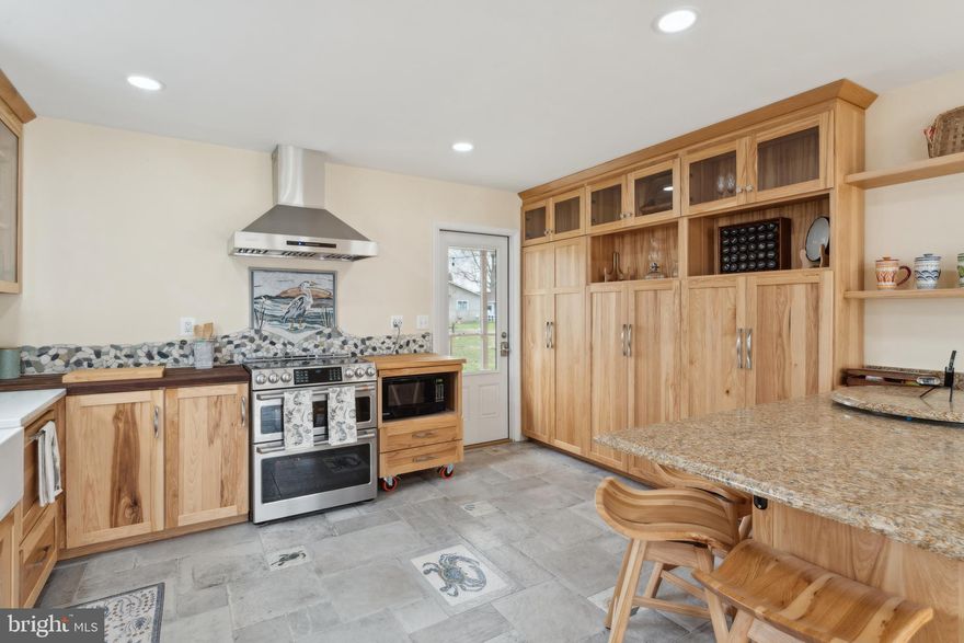 Leave the world behind as you drive the lovely country road leading to Love Point Avenue, passing by incredible waterfront estates on both sides of the road, a vineyard or two and don't forget to wave to the adorable black cow and mini donkey buddies who share a road side paddock as you travel north. Turn right onto Love Pt. Ave, a dead end road featuring the Chesapeake Bay on the left and the Chester River on the right. Literally Water, Water Everywhere! Welcome to life on "The Island". 

I can't even tell you how cute this house is...and while it was built in 1977, the shell is pretty much all that remains of the original build. Within the last 3 years this house has had a major overhaul quite literally from the encapsulated and dehumidified crawl space to the new tin roof with a solar array. The tin roofing has an expected life of nearly 50 years! The solar array is already paid for and keeps those electric bills unbelievably low.  Heck, we even have an EV Charger! Oh, my bad...the seller did retain and improve the stunning original wood flooring when the renovations were completed. The kitchen is incredibly user friendly with custom made cabinetry providing  lovely and functional storage for all your kitchen needs. The dishwasher blends in with the cabinetry with the pull out drawer and behind most every cabinet door waits a cool little gadget or shelf providing additional work space which is both functional and space saving. The same theme carries throughout the house with custom made Murphy beds that fold into the wall when not needed allowing for use of the space creating versatility should you need one bedroom or three! 
For your relaxing moments 227 offers a lovely and private screened in porch or take a trip up to the top of your private tower featuring the most amazing views The Island has to offer! To complete the island living experience we offer you four raised garden beds in which you can grow whatever you desire...the other gardens are flush with fresh rosemary, Thyme, and lavender. This is one of the most unique properties available in this day of cookie cutter homes where everyone looks the same. Don't miss this opportunity to be a part of the Island Life!