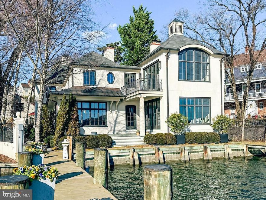 Stately French Villa on Spa Creek in downtown Annapolis! This jewel box of a home was designed and built by a renowned local architect as the culmination of an award-winning career. 

Offered completely turn-key, this exceptional residence conveys fully furnished and thoughtfully appointed—including furniture, fully equipped kitchen, linens, etc —allowing you to arrive with nothing more than a suitcase and begin enjoying the Annapolis waterfront lifestyle from day one. 

The unrivaled architectural detail, exquisitely curated finishes, and sweeping views across Spa Creek elevate this residence into a class of its own. Privately positioned at the end of a quiet street within one of downtown’s most coveted waterfront enclaves, this 3-bedroom, 3.5-bath retreat is equally suited as an elegant weekend escape or a full-time residence.

Dramatic Palladian windows bathe the interiors in natural light while perfectly framing the ever-changing harbor views. At the heart of the home, the gourmet kitchen—appointed with custom cabinetry, premium appliances, and a striking designer hood—flows seamlessly into both the formal living room and inviting family room, each enhanced by a gas fireplace and captivating water vistas. A main-level secondary primary suite offers comfort and flexibility for guests of all generations.

Upstairs, the extraordinary waterside primary suite features vaulted ceilings, walls of glass, a gas fireplace, spa-inspired bath with soaking tub, and a custom dressing room with center island. A private balcony provides the ideal perch for sunrise coffee or sunset reflections overlooking Spa Creek, Annapolis Harbor, and Eastport.

Designed for effortless waterfront living, two deep-water piers with approximately 9 feet of MLW accommodate substantial vessels, with immediate access to the Severn River, the Chesapeake Bay, and beyond.  Walkable to the shops, restaurants, and charm of downtown, this rare offering delivers convenience, privacy, elegance, and ease in one remarkable package. Welcome Home!