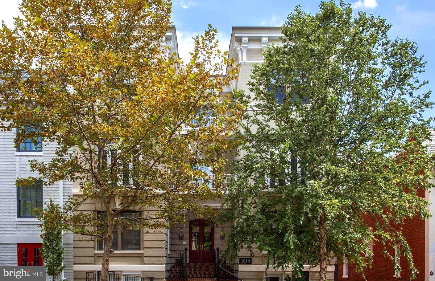Offers if any, due Tues. 6/27 at 1:00pm. Are you are inspired by Paris? If so, you don’t want to miss this impeccably renovated Parisian-style apartment in the heart of the East Village. This complete Georgetown package is a timeless and rare find offering 2BR, 2BA + library/den or 3rd bedroom + large private balcony + deeded PARKING. This home provides the beauty and architecture elements of a European treasure while checking off all the boxes a Georgetown resident could ask for in a home. Property showcases; corner unit with four exposures, abundance of natural light, high ceilings, 4-sets of French doors throughout, oversize windows, entry hall with 50’ gallery wall, the library/den could easily be a 3rd bedroom and is furnished with a wood burning fireplace, custom bookcases and French doors to a Juliet balcony, the gourmet kitchen comes complete with white shaker cabinets, professional stainless Bosch appliances, gas cooktop, breakfast bar and black Quartz counter tops, the living room and separate dining room add the perfect space to entertain special events with family and friends, French doors from the kitchen and dining room will take you to the spacious private balcony to relax and enjoy coffee or cocktails, the primary bedroom has been upgraded with a custom built-in wardrobe, two closets + ensuite bath and the second bedroom offers the perfect guest room. Additional features included, espresso hardwood floors, in unit washer and dryer, central air-conditioning, recessed lighting, extra storage in the basement, bike storage, low fee and deeded parking! 1613 30th St is professionally managed and is located in the quiet East Village close to Montrose Park, Rose Park, Book Hill, Sara's Market, Stachowski’s Market, Georgetown Club, Safeway, nearby shops and restaurants on M St and Wisconsin Ave. The enjoyment of the Georgetown waterfront is nearby as well.