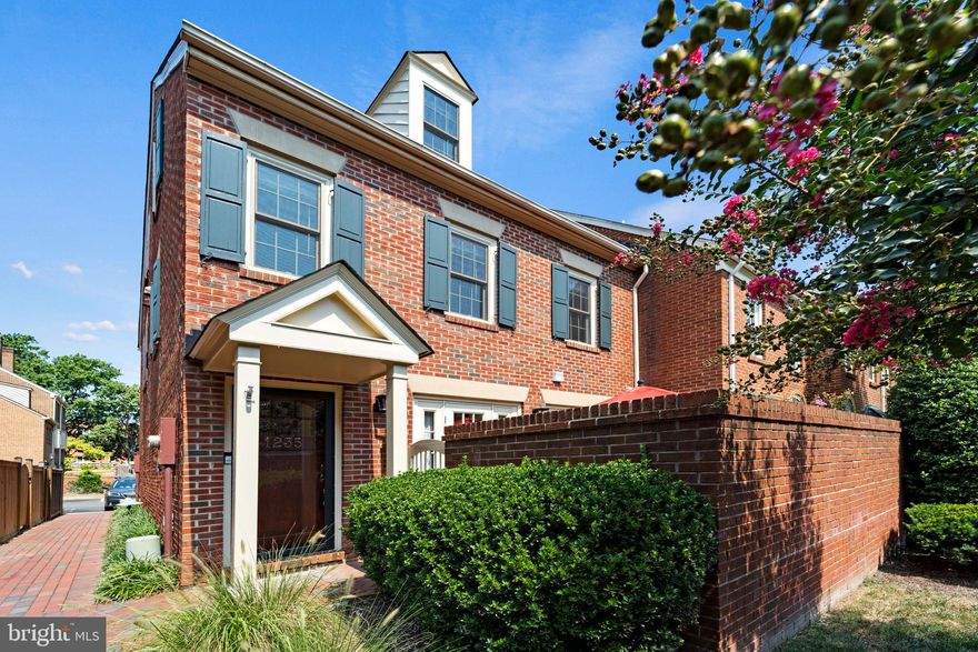 Enjoy the quiet privacy of Alexandria's Virginia Village, in walking distance to Old Town! Beautiful all-brick, end-unit, 3-level townhome with updates throughout. Enjoy a bright and sunny main level with renovated kitchen, added half bath and wood-burning fireplace. The second level offers a renovated full bath and conveniently located washer/dryer. On the top level you'll find the primary suite with vaulted ceilings, skylights and renovated en-suite bath. Back downstairs, French doors lead to a charming private patio. All new windows and doors! *Private parking lot* *Dogs allowed case-by-case* *Online Application - https://apply.link/3RiwYNv*
