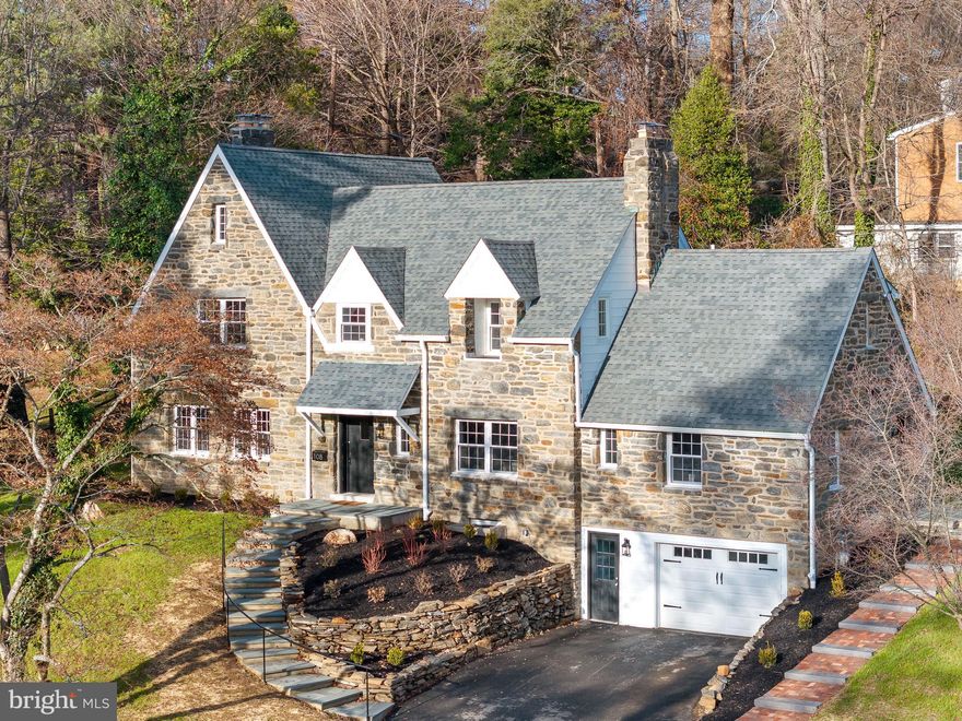 Open House Saturday, 1/18, 1-3pm. 108 Stratford Ln., is sure to check all your boxes!! This beautifully renovated Tudor-style Colonial is located in the desirable "Wallingford Hills" neighborhood. Originally constructed in 1930, this residence has been meticulously renovated from top to bottom, harmonizing classic charm with contemporary comforts. Recent updates are: new roof, gutters, windows, new wiring, new kitchen, new bathrooms, refinished hardwood flooring and new steps, patio and hardscaping. Encompassing over 3,500 square feet, this stately home offers four generously sized bedrooms, three elegantly-updated bathrooms and two half baths. As you enter through the original wood door, you are greeted by a grand foyer with a sweeping staircase adorned with original iron spindles and refinished hardwood flooring throughout. To the left, the formal living room invites you to unwind by the cozy fireplace, (with new liner) while to the right, the formal dining room, also featuring a fireplace, sets the stage for sophisticated entertaining. The newly designed kitchen is a chef's delight, offering white shaker-style cabinets, quartz countertops, stainless steel appliances including a built-in refrigerator, a butler's pantry with wine fridge, and a sunny breakfast room. Enjoy al fresco dining on the lovely new slate patio accessible from the kitchen. There is a convenient FIRST FLOOR BEDROOM SUITE with a renovated full bathroom with tub/shower combo. The second level features three spacious bedrooms and two full bathrooms. The primary suite includes a bedroom with 2 closets and a third walk-in closet with custom closet system. The stunning new primary bathroom boasts a double vanity and a large shower with body sprays and a frameless glass door.  There are 2 additional bedrooms on this level, one with a charming decorative fireplace and they share a renovated hall bathroom featuring a double vanity and tub/shower combo. The finished lower level with a new half bath, fireplace and new luxury vinyl flooring, adds over 1000 sq. ft. of versatile living/entertaining space. The attached garage, laundry area and mudroom with cubbies complete the lower level. All of this, situated in the award winning Wallingford-Swarthmore School District, located near the vibrant towns of Swarthmore & Media, with a myriad of Pubs, restaurants, festivals and “Dining Under the Stars.” Easy access to Center City Phila., the airport (12 min) or Wilmington via I95 or a quick jaunt on the Septa train to the city.