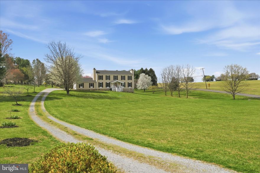 Come to Charles Town, WV and enjoy gorgeous sunsets and scenic views from this roomy 4 bedroom 2.5 bath Colonial sitting on over 2-acres. Conveniently located, only minutes to The Shenandoah River, Charles Town WV,  Harpers Ferry WV and the Leesburg VA area. Two fireplaces, one in the living room and one in the den offer a cozy atmosphere while relaxing or working from home. Well laid out kitchen with stainless steel appliances and gas cooking flanked by a large breakfast room and a separate formal dining room.  Upstairs there are four generously sized bedrooms. The primary bedroom has a large walk-in closet and full attached bathroom with a tub and separate shower. There's even an intimate little reading area tucked away upstairs. Outdoors it gets better! There are approximately 15 fruit and nut trees of varying species on the property and 100's of perennials in the fenced garden area and around the deck offering beautiful blooms throughout the growing season. Brand new HVAC in 2025! Newer roof and siding. This is a great home in an excellent area. Make an appointment for your private showing today before it's too late!