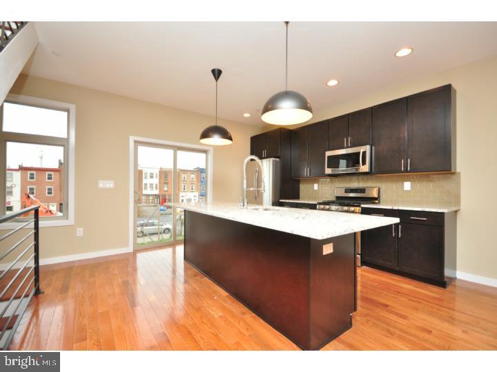 "BRAND NEW CONSTRUCTION" Amazing opportunity in Vibrant Fishtown with 1 Car Parking & Phenomenal Center City Views from Roof Top Deck! Thoughtfully designed floor plan with amazing attention to detail. First floor offers 1 Bedroom with Walk in Closet, 1 Full Bathroom & access to enclosed rear yard. Granite Countertops, exquisitely tiled glass backsplash, 42" Cabinetry & Center Island are all featured in this Gourmet Kitchen. Access to private deck extends your entertaining space. An open concept floor plan is a delightful space to entertain family & friends. Hardwood Oak Flooring, recessed lighting & plenty of natural sunlight throughout. 3rd Floor offers 2 Additional Bedrooms with Custom Closets for added storage space. Generously Sized Hall Bathroom beautifully tiled with Oversized Soaking Tub; a true delight to relax after a long day. Added bonus of finished basement that can be utilized as family room, office or gym. Energy efficient dual zoned Heating & Air Conditioning System. Save time no longer looking for a parking, arrive home to your our covered parking space. You will delight in your 500 SQ FT Roof Top Oasis with Fabulous Views of Center City & the Benjamin Franklin Bridge. Approved 10 Year Real Estate Tax Abatement. Property qualifies for 4.625% Conventional 30 year fixed interest rate Loan with 3% down and no Mortgage Insurance. Contact us for more details.