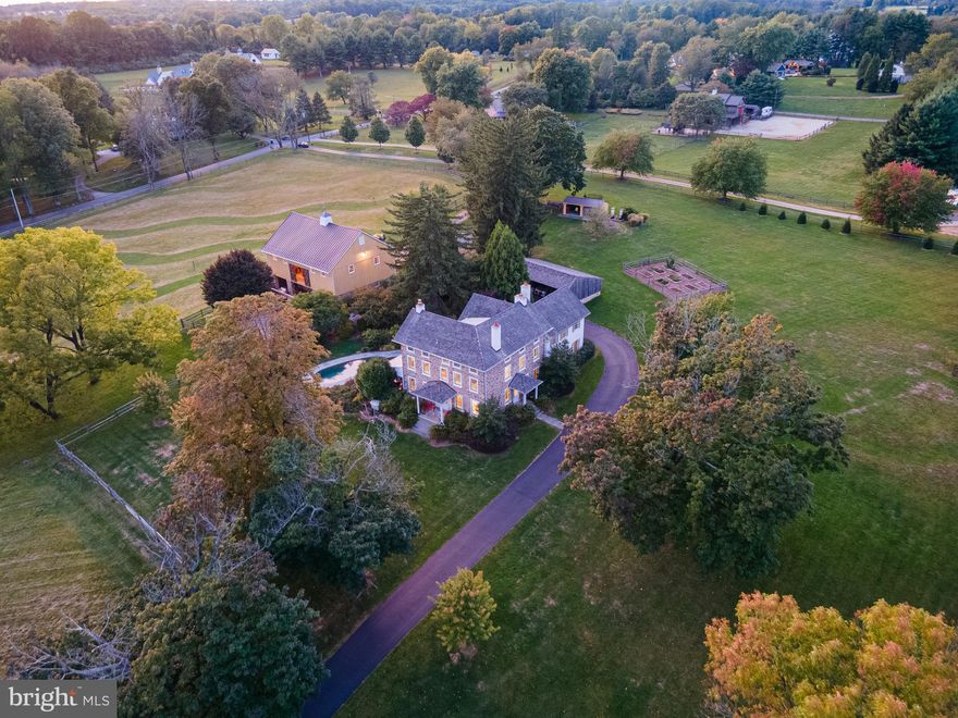 Just Available, an iconic gentleman’s farm in the heart of Radnor Hunt!  Situated on one of the area’s most coveted addresses, Hunting Hill Farm delivers on every front.  This three-story Chester County Farmhouse, dating back to the mid 19th Century, was built to last and has undergone an extensive transformation and the end result is an architectural gem, which has been lovingly restored and reconfigured to suit today’s buyer seeking amenities of the 21st Century.  Pride of ownership and diligent stewardship are evident in every nook and cranny, resulting in a truly turnkey opportunity. The home itself is approximately 5,300 sq. ft. of on-trend living spaces with state-of-the-art finishes and appointments that will appeal to any discerning buyer.  The “party barn” is an incredible feature to this farm with soaring ceilings, commercial-grade refrigeration and appliances, heat, and offers an incredible venue for grand-sale entertainment and memorable fundraising events. The bank barn’s lower level offers impeccably maintained spaces, four spacious stalls, wide aisle, on-demand hot water, and outdoor shower.  Endless outdoor living spaces abound with stunning artful masonry walls and outdoor fire pit. Salt-water, in-ground pool has been entirely refurbished and is situated in a private manner with distant pastoral views.  For the equestrian buyer, this property offers easy access to trails and is just a short hack to Radnor Hunt Pony Club. The location provides a quintessential town & country setting offering scenic views and vistas in an area known for land preservation with thousands of acres under conservation easements, multiple nature preserves, perfect for any outdoorsman and nature-lover at heart yet so close to SEPTA and AMTRAK rail service to Center City Philadelphia, New York City, Washington, D.C. and points beyond. Easy commuting to Philadelphia International Airport (PHL).  Enjoy endless Main Line shopping and dining destinations, award-winning Great Valley Schools as well as a host of highly regarded private schools. This legacy property has been admired by many and is now offered to the next lucky buyer.
