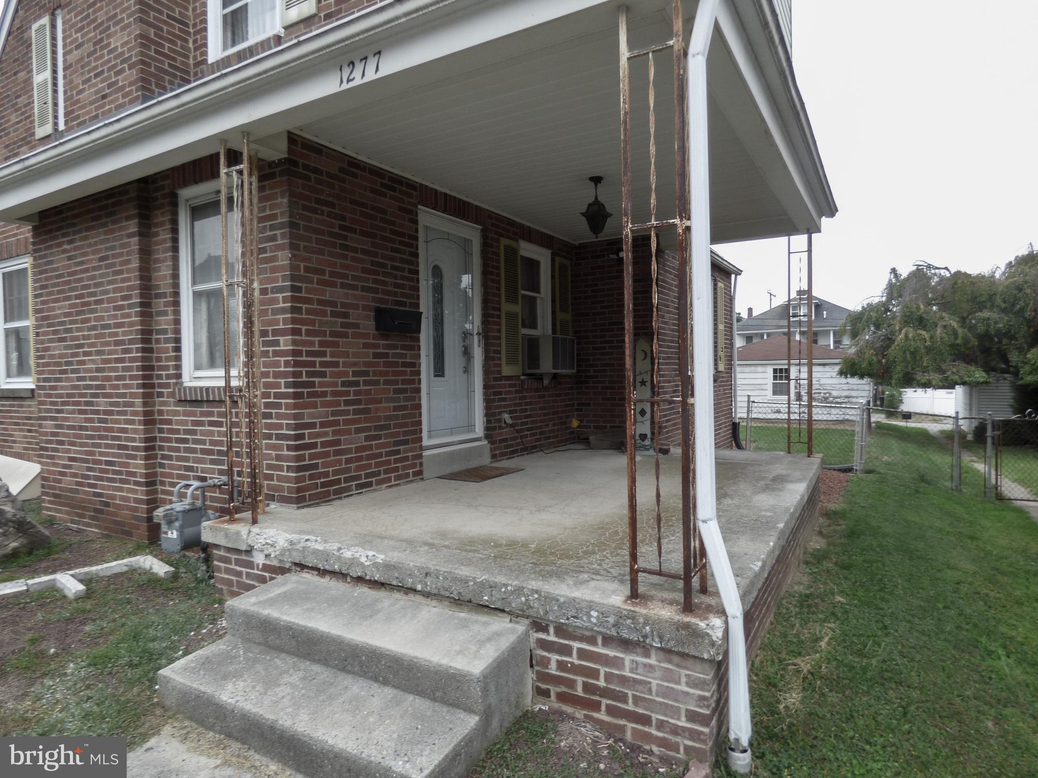 This 2 bedroom, 1 bath brick & aluminum 1 1/2 story home built in 1939 is being sold “AS IS” - this is an estate sale & a short sale & a reverse mortgage - the seller won’t make any repairs to the home or the garage - so don’t ask. This property has deferred maintenance from peeling lead based paint to a tarp covering a broken basement bilco door which leaks, a clearly water damaged basement, a leaky roof in multiple locations, carpeted floors, a dated full bath & lead based paint peeling ceilings in the kitchen. Gas radiator boiler in the bsmt appears to be original to home. Use caution on front porch as the concrete is failing & porch supports are rusted. Front door does not operate - door knob is broken - must use side door. DANGER: Do not walk on the blue tarp on the rear deck - the deck is not safe. Kitchen window has plastic covering - do not remove - window has a problem. Plexi-glass covering the casement windows on gable end of the home to reduce water flowing into the bsmt when it rains - do not operate bsmt casement windows. Water logged pool table in the bsmt will not be removed by seller. Listing agent has not tested for mold in the bsmt - enter at own risk.