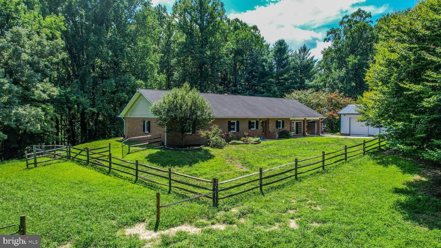 OPEN HOUSE SUNDAY 11/17 1:00-3:00.  
VA ASSUMABLE LOAN (2.7% ) FOR VA QUALIFIED BUYER. Welcome to your dream farmette at 5916 Old Croom Station Rd, Upper Marlboro, MD! This charming 3-bedroom, 2-bathroom rancher is set on a picturesque 7-acre estate, perfect for horse enthusiasts or anyone seeking a serene countryside retreat. Enjoy single-level living with a spacious and functional layout that includes an updated kitchen, brand new carpets and fresh paint. The cozy living spaces provide a warm and inviting atmosphere, ideal for relaxing after a day on the ranch.

The property features a well-maintained 7-stall horse barn, complete with a loft for hay storage, offering everything you need for horse care and management. All 7 acres are fenced, with additional sections to allow for easy rotation and management of different fields, providing plenty of space for your horses to roam, graze, and exercise in a safe and controlled environment.

A brand new detached garage, fully insulated and equipped with ductless heating and cooling, adds incredible versatility to the property. This space includes a full 3rd bathroom and can be used as an office, storage, or for your cars – the possibilities are endless. Located in tranquil Upper Marlboro, MD, this property offers both privacy and convenience, with easy access to DC and major routes. Don’t miss out on this rare opportunity to own a fully-equipped equestrian property with modern amenities and a comfortable home. Schedule your private tour today and experience all that 5916 Old Croom Station Rd has to offer!
Recent updates include HVAC, fireplace replacement lining, carpet, paint, a 1 year pre paid pest control program, brand new windows and a newly built fully insulated detached garage