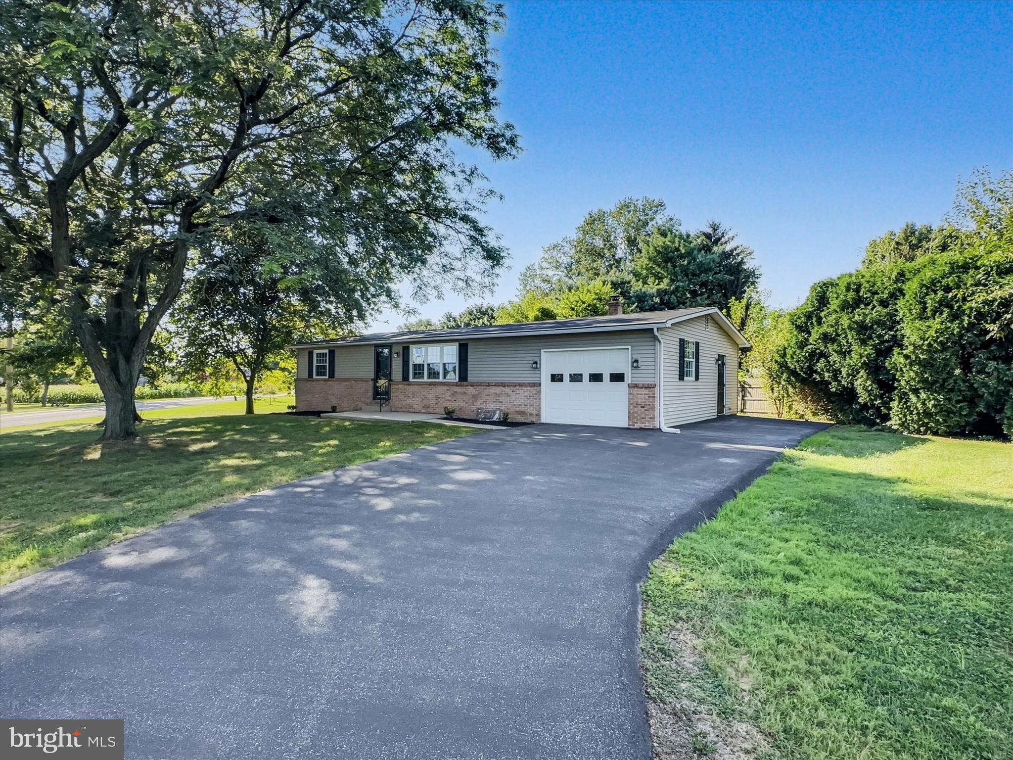 Welcome home! Whether you're upgrading or downsizing this fully renovated ranch home has it all! Plenty of space including 3-4 bedrooms, 3 full baths, versatile living and dining areas, plenty of storage, a garage, beautiful views, and all of the upgrades you are dreaming of! 1006 Stellar Drive in Mount Joy offers 1,316 sq ft of living space on the main floor plus a fully finished lower level. Upon entry you're greeted by the spacious living room with luxury vinyl plank flooring and tons of natural light. Just off the living room is the brand new kitchen complete with dining space, an island with additional seating, custom cabinets and quartz countertops, a ceramic tile backsplash, and new stainless steel appliances. The main floor offers 3 bedrooms and 2 full bathrooms including the primary bedroom with its own full bathroom. The laundry is also located on the main floor for added convenience and ease of everyday life. The lower level offers a large rec room with walk-in closet, an additional flex room or 4th bedroom, a 3rd full bath, and an additional storage room for all of your treasures and holiday decor. This home has been thoughtfully renovated throughout and is located within the Donegal School District, providing a great layout and accessibility to endless local amenities and travel routes. The beautiful corner lot offers views of beautiful peaceful fields. Call today to make this home your own! Ask about no-money-down USDA financing!