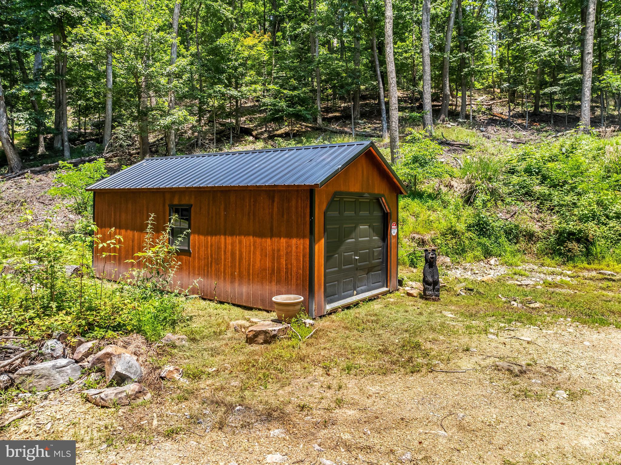 Looking for a place to get away? You can do it on these two lots totaling 3.095 wooded acres in a great community with a community lake and beach area. Lots 6 & 7 are being sold together as one. Property has a driveway cut in and a building to store your things while you're gone. Build yourself a cabin or just come hide from it all. Community ball field for the kids is another plus. And let's not forget the 22,000 acres of public hunting. That's right, the only thing that divides you from this hunting ground is the road. Walk across the road and you are there. No more getting up hours early for the long drive to go hunting or hiking, walk to it in less than a minute. Less than 30 minutes to the Historic town of Berkeley Springs/Bath, Martinsburg, WV & Intersate-81.
This is two Lots, 6 & 7. Tax Id # for lot 7 is 07 10A000700000000