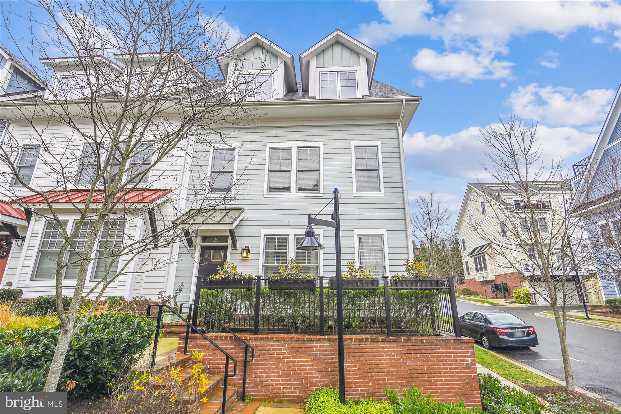 Stunning 4BR/3.5BA end-unit townhome in Chelsea Heights located in the heart of downtown Silver Spring! Newly built in 2015 by EYA, this exquisite home features roughly 3,000 sq.ft. of open concept, natural light filled space with many custom features in a Craftsman style. Open concept living at its finest with gourmet kitchen complete with Kitchen Aide stainless appliances, large pantry, beautiful quartz countertops, insta hot dispenser, deep inset stainless steel sink and loads of cabinetry Kitchen is open to breakfast area, dining room and family room space which features marble surround gas fireplace, high ceilings and is encased in tall windows. Truly spectacular! This home stands apart from the neighborhood with detailed features: exposed brick staircase on lower level, hardwood floors throughout, whole home humidifier, recessed lighting and surround sound speakers throughout entire house. Extra bonus is the overabundance of storage including step-in attic on upper level, lower level walk-in closet plus two lower level coat closets. Two car garage is temperature controlled and offers additional step-in storage, prewire for electric car charger and hose bib. Upper level is equally exciting with oversized primary suite with tall ceilings, custom walk-in closet and primary ensuite bath featuring large walk-in shower with bench, double sinked vanity offering lots of cabinet storage and an abundance of granite counter space as well as heated bathroom tiled floors (extra bonus). Upper level also boasts two large bedrooms each with oversized closets offering custom closet inserts and large laundry room with front load Whirlpool washer and dryer as well as a large folding counter and cabinetry that reaches to the ceiling. Prepare to be wowed by the amazing outdoor entertaining space as the home features a spacious 320 sq. ft. rooftop terrace with a second kitchen, including refrigerator, stainless steel cabinets, granite counters, sink, gas fireplace and outdoor TV (conveys as is). Home offers on-grade level oversized bedroom which could double as den or office and features large windows and french doors. The third full bathroom with tub is also located on this level. Built to LEED for Homes standards (certified), with an integrated security system, smart light switches, and LED lighting. As a bonus, the second deck with natural gas grill connection is located off the main living area. HVAC has recently been replace with a high efficiency multi zone system. Home is located in an ideal urban setting convenient to Metro (Red Line and Purple Line), The Fillmore, AFI Theater, Ellsworth Urban Dog Park, Veteran's Plaza, Whole Foods, dining, boutique shops and all that Silver Spring has to offer. Truly one of a kind as it was a former EYA model and offers so many upgrades. It won't last long!