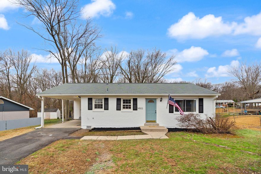 Discover this beautifully renovated 3BR, 2BA ranch/rambler in the heart of Dale City! Boasting an attached carport and a freshly painted exterior, this home radiates curb appeal. The 2024 renovation shines throughout with newly refinished sparkling hardwood floors, updated kitchen and bathrooms, fresh paint, recessed lighting, and all new electrical. The entry-level open floor plan is both practical and perfect for entertaining, featuring a spacious living and dining room combination. The modern kitchen is a showstopper with brand-new soft-close cabinets, gleaming Quartz countertops, stainless steel appliances with gas cooking, and a cozy breakfast nook. A new stackable washer and dryer add convenience. All bedrooms are generously sized, and both bathrooms have been fully renovated with stylish finishes. Additional upgrades include a new 200-amp electrical panel. Step outside to a yard surrounded by mature trees offering shade and privacy—a serene retreat! Conveniently located near major commuter routes, shopping, and dining, this home is the perfect place to call home.