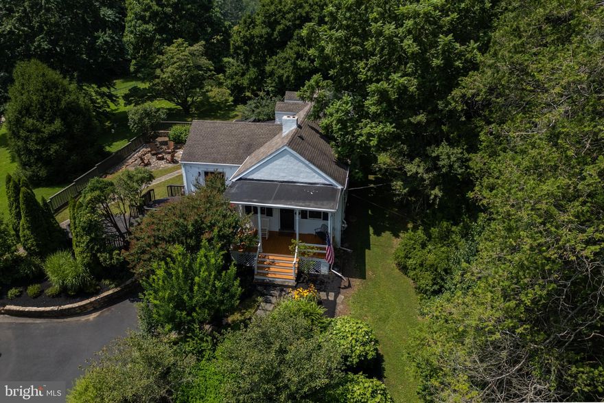 Incredibly unique and simply stunning! 617 Unionville Rd is one of those rare gems, jam packed with character, and offering amazing indoor and outdoor living spaces - all in the highly rated Unionville-Chadds Ford School District. This yard is so compelling – with a covered front porch, multi-tiered deck and stone patio – you may not want to go inside, but once you do, the home is so charismatic, bright and inviting that you might not want to go back out! In a stunning blend of old-world charm and chic design, you’ll step into a front parlor with the inviting vibes of a British pub, complete with a wood burning fireplace and a bar with 3 stools. As fun as it would be to spend the day in the parlor, the rest of the house has so much to offer. There is a beautifully styled modern kitchen and bathrooms, a dedicated dining room, a living room with another wood burning fireplace that features a magnificent stone hearth, and there’s a spacious, light-filled sunroom with a skylight and built-in bench. This home has 4 bedrooms and 3 full bathrooms, but in another unique twist, 2 bedrooms and 2 full bathrooms are located on the main floor, including the owner’s retreat with a walk-in closet and en suite bathroom. The 2nd bedroom shares its closet space with the washer, dryer, and could make a wonderful home office if you don’t need to use it as a bedroom. Upstairs, the 2 bedrooms and full bathroom are just as charming as the rest of the home, with A-frame roof lines, neutral carpeting in the bedrooms and nice natural light. A home for all seasons – in spring, you’ll be wowed by the blooms on the giant “teacup” magnolia tree, in summer and autumn you’ll be surrounded by lush, wooded landscaping in your private outdoor oasis, and in winter you can enjoy the views and watch the snowfall from the sunroom which includes an electric fireplace. The backyard also features a gigantic shed which is wired with electric and is fitted with workbenches. To top it off, 617 Unionville Rd is situated just minutes from the heart of Kennett Square, minutes from Longwood Gardens, and you’ll enjoy convenient access to Rte 1. Truly a must-see home! Request a personal tour today!