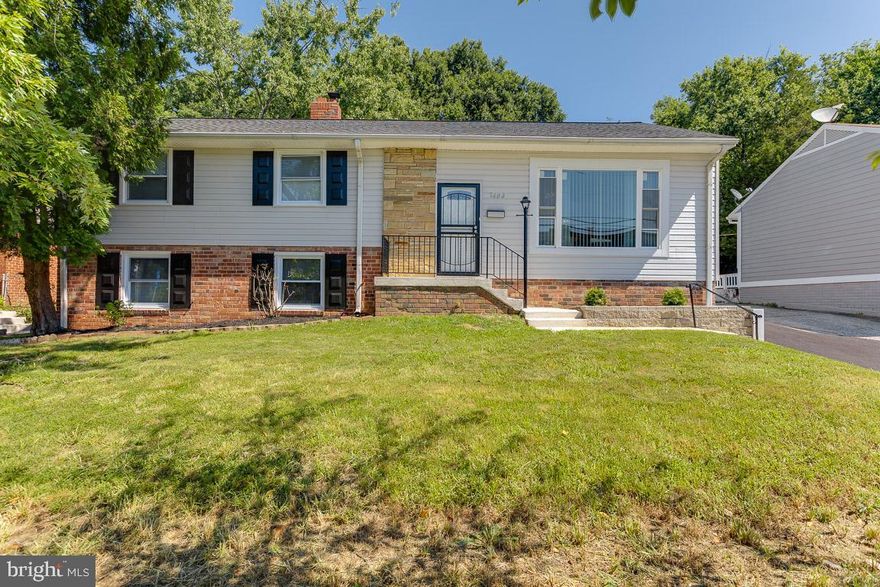 Experience the WOW factor as soon as you enter this split level home. Inviting living room  with picturesque bay window, and Remote Controlled Chandelier Ceiling Fan with Retractable Blades.  Spacious Gourmet Kitchen. with  New Stainless Steel Appliances,  electric range w/ 5 elements,  built-in microwave, granite countertops, and an abundance of soft close cabinets.  Located off the kitchen is a dining area,  with table space seating  for 8. Luxury Vinyl Plank(LVP) Flooring throughout main and lower levels.  This home has plenty of space to relax or gather with friends in the lower level Family Room, accented with chair railing,  shadow box molding, space for game/play area,  complete with floor-to ceiling Brick Front  Electric Fireplace with adjustable flame color,  and full bath with  spa-like shower.  Ascend to the upper level and you are greeted with  hardwood floors, luxurious  full bath, with marble floor, contemporary double vanity with stone top, soaking tub,  elegant shower, and built-ins.  Home is complete with three generous sized bedrooms with Ceiling Fans & OH lights, and  His & Hers Closets on upper level.  Home also has utility & storage room with New Washer & Dryer. The exterior of the home is as impressive as the interior.  This home is perched on a nice lot w/ front porch, parking for 8-9 cars in the new asphalt driveway and rear parking pad, concrete patio, grass area for  outdoor fun, and shed.   New A/C Unit & Windows(2022); Roof, Furnace & Hot Water Heater (3 years);  This home is perfectly located near shopping, restaurants, retail and all of the  conveniences you'll need or want. Minutes from the Beltway, Rt 50,  steps to public transportation(bus), short car/bus ride to multiple Metro Stations and easy access to DC, VA. & all parts of MD.  Once you are under contract, plan to attend the New Carrollton Community Day on 9/24th to experience the BEST of the City of New Carrollton's businesses, people and community.   Everything has been done to make this house YOUR home; the only thing missing is YOU! Schedule your showing today!