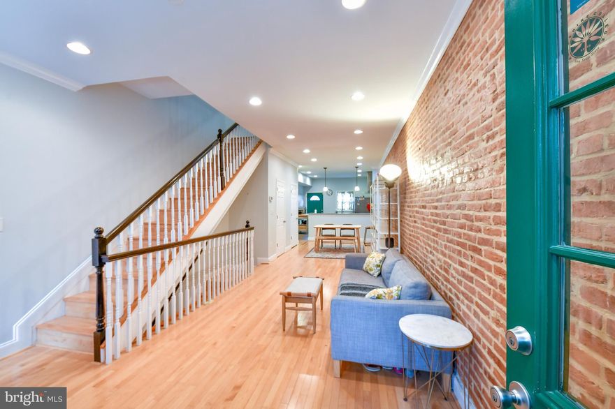 Welcome to this beautifully renovated brick townhome, where charm and history meet modern luxury. Originally built in 1910 and thoughtfully reimagined with a top-to-bottom renovation (2015), this move-in-ready residence offers four finished levels of flexible living space.
This spacious home features 4 bedrooms, 2 full bathrooms, and 1 half-bath, designed for both everyday comfort and effortless entertaining. The open-concept main level showcases gleaming hardwood floors, recessed lighting, a huge kitchen, and a defined dining area—creating a warm and inviting atmosphere from the moment you enter.
The updated kitchen is a standout, featuring stainless steel appliances, upgraded countertops, and generous prep space, perfect for hosting or daily living.
Upstairs, the second level offers two generously sized bedrooms, a full bath, and a convenient laundry closet. The private third-floor primary suite is a true retreat, featuring a walk-in closet.
The fully finished lower level provides additional versatile living space—ideal for an exercise room or a space to escape.
Enjoy outdoor living at its best with a spacious rooftop deck that provides full sunlight and has a view of the city skyline. This space is large enough to host a small gathering or just to unwind and enjoy either the dawn of a new day or the sunset.  
Additional Highlights:
•