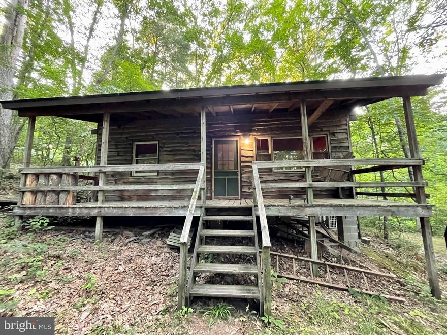 Great AirBnB or second home!  Newly renovated, very cute and private cabin with a creek running through the property!  The 2nd bedroom is a loft, but there is a sitting room that could also be made into another bedroom.  Has room for laundry, hook ups are in the spacious bathroom. Screened in porch and a full covered porch to sit on and listen to the creek and the birds and watch the deer and other wildlife!  LVP flooring throughout.  Rough sawn live edge wood siding.  New kitchen, shaker white cabinets, butcher block counter and stainless steel appliances.  New standing seam metal roof.  New mini split heat and ac unit.  Very peaceful, private, perfect AirBnB.  Has a creek running through it and tons of wildlife and birds to listen to.  All this place needs is a hot tub and a fire pit!  Agent is owner. The furniture currently in the home conveys.