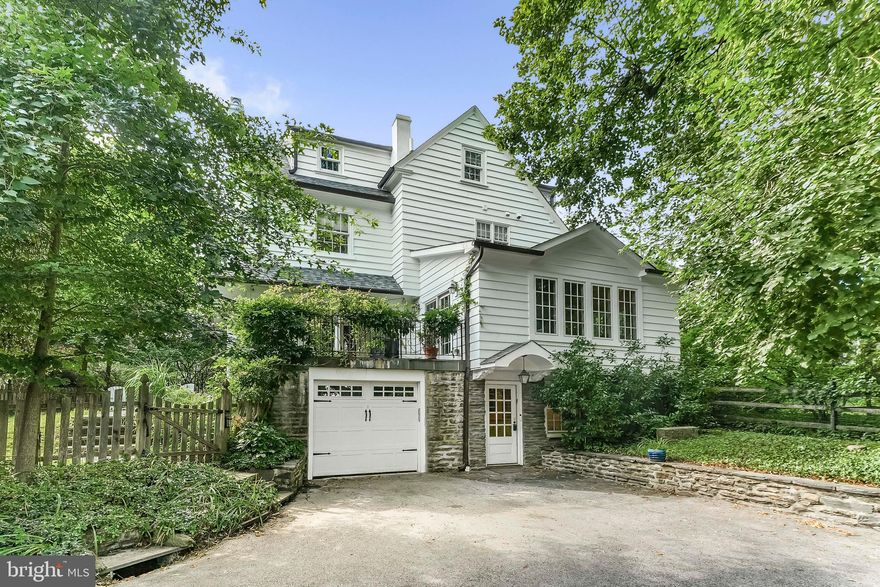 This stately and fully updated 1920s Colonial offers over 3,100 square feet of classic charm blended with modern amenities in one of Wynnewood’s most walkable and desirable neighborhoods. Set on a private half-acre lot with mature landscaping, the home features tall ceilings, original hardwood floors, elegant moldings, custom cabinetry, and abundant natural light through newer Pella and Marvin windows. A formal living room with a fireplace and French doors opens to a large bluestone terrace, while the kitchen connects seamlessly to a vaulted family room addition — creating ideal circular flow for entertaining. A formal dining room, powder room, and lower-level mudroom with dog wash add functionality and comfort.

Upstairs, the expansive primary suite includes two walk-in closets and a spa-like bath with soaking tub, glass shower, and double vanity. A guest suite, large laundry room, and three additional bedrooms complete the upper floors, along with a stylish hall bath with clawfoot tub. Enjoy rolling lawns, off-street parking for multiple cars, an attached garage/workshop, and extensive upgrades including 200-amp electric, new HVAC, and a newer water heater. Just steps from Suburban Square, Narberth, regional rail, top-rated Lower Merion schools, and more — this move-in-ready home offers timeless elegance and everyday convenience in the heart of the Main Line.