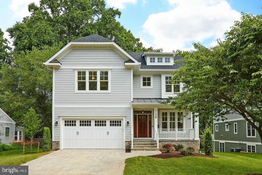Welcome to your dream home in the heart of Falls Church, and with McLean Schools! This stunning 6-bedroom, 5.5-bathroom masterpiece is a true gem, offering a perfect blend of elegance, comfort, and modern convenience. 

As you step through the grand entrance, you'll be immediately captivated by the meticulous attention to detail and craftsmanship that defines this home. Gleaming hardwood floors extend throughout, setting the stage for an atmosphere of timeless sophistication.

The gourmet kitchen is a chef's paradise, featuring a spacious layout, a massive granite island that's perfect for both meal prep and casual dining, and top-of-the-line stainless steel appliances that will inspire your culinary creativity. Whether you're preparing an intimate dinner for family or hosting a lavish soirée, this kitchen is sure to impress.

The main level offers a versatile flex room that can serve as a bedroom with an en suite bath, ideal for accommodating guests or as a home office to suit your lifestyle.

Crown moldings and custom millwork adorn the interior, adding an extra layer of elegance to your living spaces. Recessed lighting creates the perfect ambiance throughout the day and night, and large windows invite an abundance of natural light, making every room feel inviting and warm.

The lower level is an entertainer's dream, complete with a media room, a bedroom, and a full bath. Movie nights, game days, and gatherings with friends and family will be unforgettable in this incredible space.

Step outside to your private oasis where you'll find an extensive rear yard hardscape featuring a luxurious spa tub and a fire pit, perfect for relaxing evenings under the stars or lively outdoor gatherings. The Hardiplank and stone exterior add to the property's curb appeal and durability, ensuring low maintenance and long-lasting beauty.

With close proximity to major commuting routes, your daily commute will be a breeze. Explore nearby shops and restaurants, and enjoy all the conveniences and amenities that this fantastic location offers.

This Falls Church haven truly has it all – space, luxury, convenience, and style. Don't miss your chance to make this extraordinary property your forever home. Schedule your private showing today and prepare to be captivated by the lifestyle this residence affords. Welcome home!