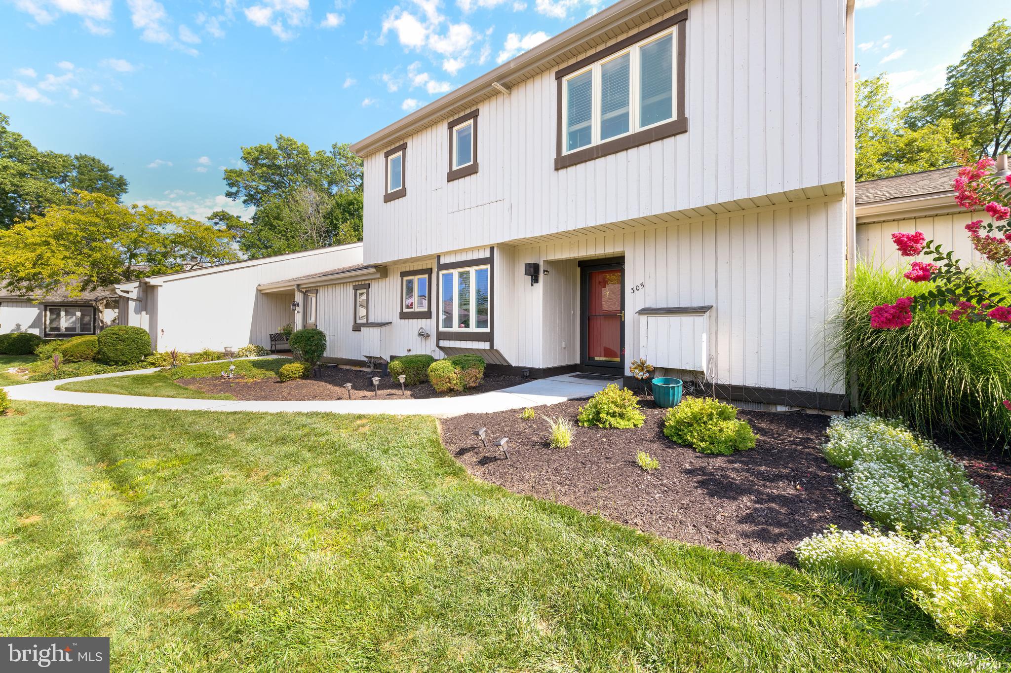 Welcome to 305 Devon Lane! A bright and tastefully renovated Oxford model, located within the Devonshire Village of popular Hershey's Mill. The perfect end of cul-de-sac location offers privacy, with picturesque views of open space and golf course. The first floor features a welcoming foyer with wainscoting, redesigned powder room and laundry room with pocket door. The kitchen is breathtaking, with custom soft close cabinetry, granite countertops, stainless steel appliances, tile backsplash and recessed lighting. Adjoining the kitchen is a spacious breakfast area with deep-sill window and pantry. The den (formally dining room) features a sliding door to private patio, recessed lighting, ceiling fan and both pocket and sliding barn doors. Opening from the hallway and den is the living room with decorative fireplace, vaulted ceiling, ceiling fan and sliding door to patio. Upstairs you will find the primary suite with sliding door to deck, ceiling fan, walk-in closet, second closet and a redesigned primary bathroom. The spacious second bedroom includes an en-suite bathroom with shower/tub combination and ceiling fan. Hershey's Mill is a vibrant 55+ gated community, conveniently located between West Chester and Malvern. Amenities include a community center with library, pool, tennis, pickleball, wood shop, gardening area and scenic walking trails. Golfing membership for an additional fee. Enjoy stress-free living at its best. Schedule an appointment to see this pristine unit today!