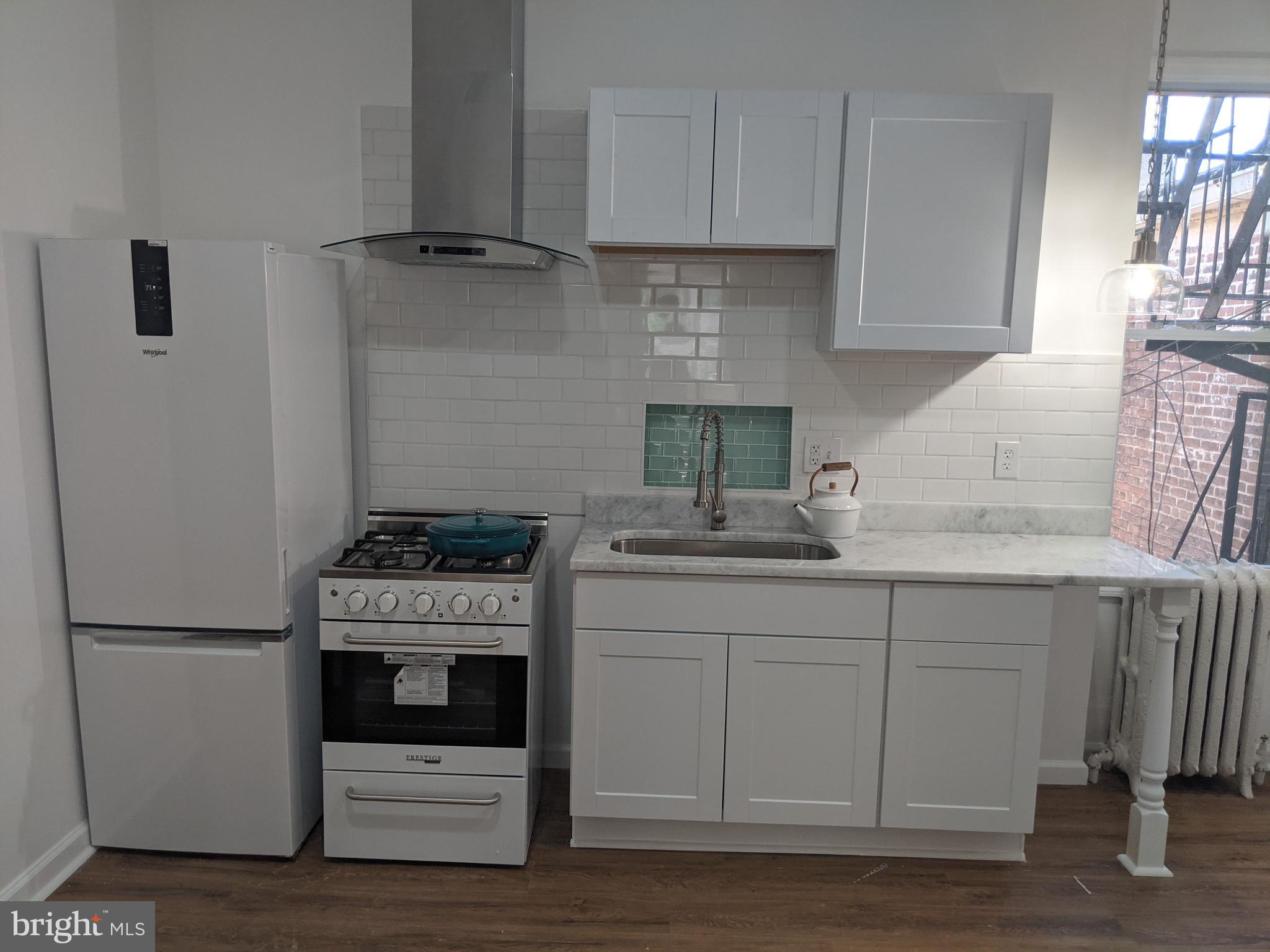 Discover this spacious and updated 1-bedroom, 1-bathroom apartment located on the second floor of a charming building in the heart of Charles Village. Featuring a generously sized living room and a separate dining area, this apartment offers plenty of room to relax and entertain. The kitchen and bath have been thoughtfully updated to blend modern comfort with classic charm.
Enjoy the convenience of a shared common area in the basement with a washer and dryer, along with one dedicated off-street parking space. Just steps from the vibrant amenities of Charles Village and within walking distance to Johns Hopkins University, this apartment offers both comfort and location in one of Baltimore’s most walkable neighborhoods.