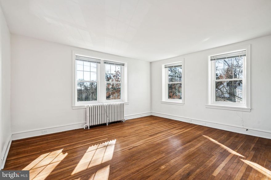 Discover comfortable living at 7001 McCallum Street #C, a beautiful 2-bedroom, 1-bath apartment in the vibrant West Mount Airy neighborhood offers both classic charm and modern luxury. This top-floor unit welcomes you into a spacious living room, complete with original oak hardwood floors, a large coat closet and seamless flow into the dedicated dining area. The recently renovated kitchen boasts sleek granite countertops, stainless steel appliances, and modern finishes. The hallway, which also features a private side entrance, leads to two well-sized bedrooms—each with ample closet space and natural light. The bathroom is tastefully updated with black and white subway tile, brass accenting, new tile flooring, and a marble vanity. Additional perks include shared laundry facilities, basement storage, and access to a private garage for an extra $100/month, along with ample street parking. Nestled in one of Philadelphia's greenest areas, you'll be moments from the Wissahickon Trail and Lincoln Drive, which grants quick access to Kelly Drive and I-76, the H bus, and a variety of shops, cafes, and restaurants only a short walk or commute away from this beautiful unit. This is an ideal home for those seeking a balance of urban convenience and natural beauty.