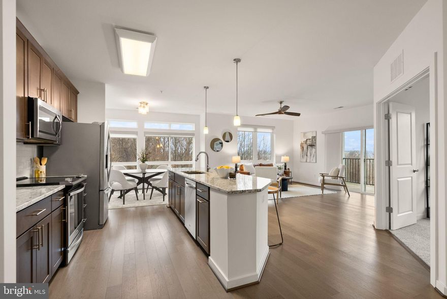 Miss low rates? Assume the loan here at 2.625% - VA Loan - You do NOT have to be a veteran to assume! Come calculate the savings today!

Welcome to a luxurious lifestyle at 9450 Silver King Court, Unit 203, in the heart of Fairfax, VA! This modern 2-bedroom, 2-bathroom condo offers a generous 1,472 square feet of living space, complete with a third room perfect for an office or den. 

You can step inside this beautiful corner unit and be greeted by an open floor plan that seamlessly blends living and dining areas, creating an ideal space for entertaining. The kitchen is a chef's dream, featuring granite countertops and sleek stainless steel appliances. Enjoy cozy evenings or morning coffee on your private balcony. Retreat to the primary suite, which boasts a double sink, separate soaking tub, and shower, your personal spa experience. Vinyl floors run throughout, adding to the modern vibe of the space. Convenience is key with in-unit washer and dryer, assigned parking, making it a breeze ensuring you never have to worry about where to leave your car. This secure building offers fantastic amenities including a gym, common storage, and a barbecue area. Ideally located just minutes from major highways and only 1.7 miles from the Vienna/Fairfax-GMU Metro Station, this condo offers the perfect blend of style and convenience. Whether you're commuting or exploring, you'll enjoy easy access to everything the area has to offer. Step outside to find scenic biking and walking trails along Accotink Creek, or head across the street to the Army Navy Country Club. You're also just moments from a wide variety of shopping and dining options, including Trader Joe's, Fair City Mall (featuring Safeway, Burlington, and HomeGoods), and Fairfax Circle Shopping Center. Call for more details and make this place home!

Open House - Saturday - January 17th - 2 pm to 4 pm AND Sunday - January 18th - 1 pm to 3 pm