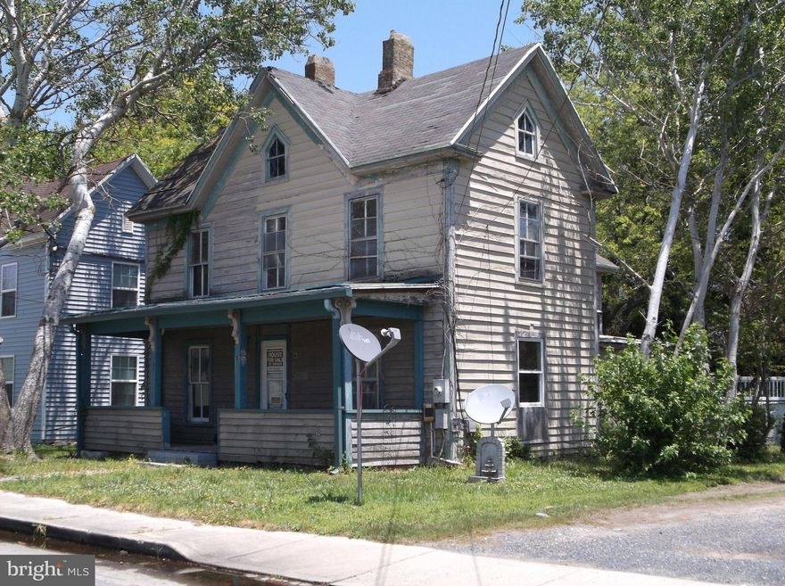 Bring your renovation skills!  New subfloors on first floor, some new windows, sheet rock installed. Insulated steel rear door.  Three bedrooms and 1/2 bath on second floor.  Needs much work, but located conveniently, with public water and sewer in quiet side street in City of Crisfield.   Possible owner financing with 30% down.