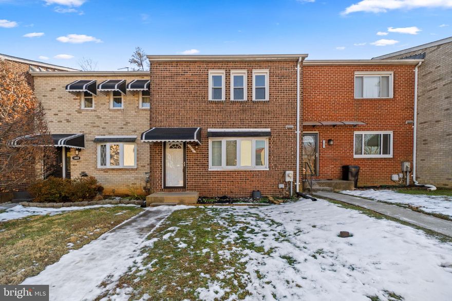 Stylish townhouse offering 1,750 square feet, 3 bedrooms, 1 full bath, and 1 half bath in charming Discovery Acres. The sunlit main level welcomes you with a foyer featuring a pass-through window to the beautifully updated kitchen, creating an open and airy feel. The kitchen boasts stainless steel appliances, bow windows, and a cozy breakfast area. Just beyond a convenient powder room, the spacious living room shines with a modern light fixture. Upstairs, three generously sized, carpeted bedrooms include an expansive primary bedroom with a walk-in closet. A well-appointed full bathroom with a dual-sink vanity completes the upper level. The finished lower level offers a versatile recreation room with walk-out access to a flat, fenced backyard featuring stepping stone paths. A flexible bonus room, ideal for a home office or guest space, and a utility room with laundry complete this thoughtfully designed home.