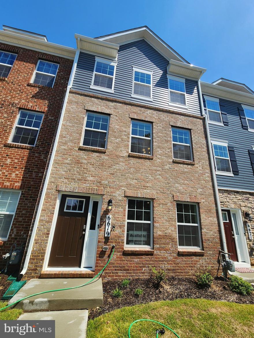 QUICK MOVE IN!!!  This town home located near opened green space and ample parking. This Columbus townhome offers1,962 square-foot, with 3 bedrooms, 2.5 bathroom, an 18x6 DECK INCLUDED and 2 car rear loading garage. This home is spacious and features an open living concept. The main level features a middle island kitchen with Stainless Steel Whirlpool kitchen appliances with 5-burner gas range, upgraded Dark Expreso Cabinets and Granite counter tops. Hard surface flooring on whole main level. The third level has a gorgeous owners suite with a large walk-in closet and features a luxury owners shower with Granite counter tops. Two secondary bedrooms, upper level laundry hook up, and hall bathroom with Granite counter tops. There is plenty of space for entertaining family and friends in your finished lower level rec room.  This home is also equipped with smart home technology. The package includes a keyless entry, Skybell (video doorbell), programmable thermostat to adjust your temperature from your smartphone and much more. Commuting and traveling is made easy with quick access to 1-495, Route 5 and to the Washington DC area.