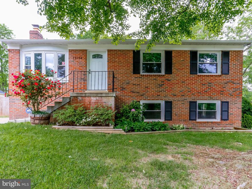 4 BR 3 BA brick front located in a quiet cul-de-sac. Renovated kitchen & Bathrooms--new cabinets, quartz countertop. Abundance of light, Tile floors in Kitchen. Newer windows. Fireplace in large rec room. W/D in separate room w/ shelves for storage. Refinished Deck, New Patio. New 12K- HVAC -UV light System w/Home Humidifier & Newer Sliding glass doors on both levels lead to a flat fenced backyard