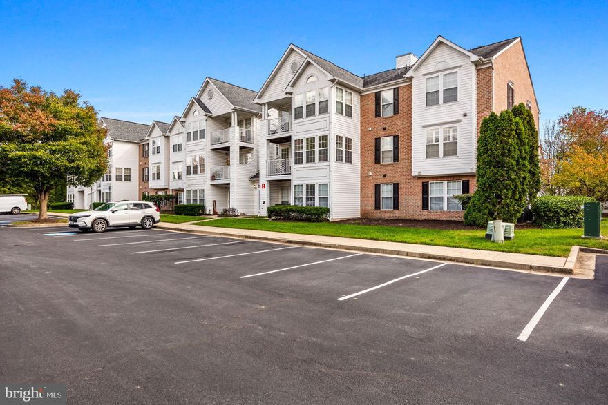 Welcome to 703 Harvest Run Drive #103, nestled in the highly desirable Piney Orchard community of Odenton, MD. This stunning ground floor 2-bedroom, 2-bathroom condo has been completely renovated and is ready for you to move right in. Step into the beautifully updated kitchen with pantry featuring exquisite granite countertops, a chic subway tile backsplash, crisp white cabinetry, and sleek stainless steel appliances. The sunlit breakfast nook offers the perfect spot to enjoy your morning coffee or host a gourmet dinner party.

The spacious living area flows seamlessly, creating a warm and inviting atmosphere for relaxing or entertaining. Retreat to the primary suite, complete with a walk-in closet and a newly renovated en-suite bathroom, showcasing custom tile work, modern fixtures, and a stylish vanity. The second bedroom also enjoys its own fully updated bathroom with the same attention to detail.

This main-level condo includes a charming patio for outdoor relaxation and convenience. Great and easy access to sneak out the backdoor to hang on your patio and walk your furry family members. There is also a storage closet! The building offers a secured entrance for peace of mind, along with a separate laundry room that boasts a brand-new washer and dryer. With hardwood floors in the main living areas, plush carpet in the bedrooms, new HVAC, and a new hot water heater, no detail has been overlooked.

Residents of Piney Orchard enjoy a wealth of amenities, including three swimming pools (one indoor), tennis courts, a community center, five playgrounds, and a fitness center. The parking lot next door to the building is equipped with six electric car charging stations and offers plenty of parking for residents and guests alike.

Conveniently located near major highways, BWI Airport, the train station, and a variety of shops and restaurants, this home is perfect for anyone looking for both comfort and convenience. Don’t miss the opportunity to make this beautifully renovated condo your own!