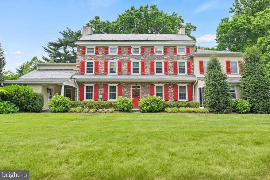 Prepare to be captivated by this exquisitely renovated farmhouse, a true gem nestled on over two acres of lush, landscaped paradise. Imagine strolling through your vast garden, adorned with enchanting willow trees, stately arborvitae, delicate cherry blossoms, fig trees, PA wine trees, white and black grapes, mulberry trees, and raspberries—truly a gardener's dream come to life. Built in 1800, this historic home stands as a testament to timeless craftsmanship, featuring hand-hewn beams and original stone foundations that have endured for over two centuries. Unlike modern constructions, this residence offers unparalleled character and durability, seamlessly blending classic charm with enduring quality. This distinctive three-story home is perfectly situated on a serene cul-de-sac within minutes from downtown Ambler, shopping, Septa and major roadways for easy travel. Recent upgrades have transformed this home into a modern marvel, featuring stunning cherry hardwood floors on all three levels, upgraded electrical systems, a radon mitigation system, brand new AC,  a new gas water heater, a new furnace, and updated toilets. With six spacious bedrooms and four luxurious bathrooms, this residence offers unparalleled comfort and elegance. The formal living room, complete with built-in bookcases and a cozy fireplace, sets the tone for sophisticated living. The warm family room, highlighted by a large hearth, invites intimate gatherings. You'll also find a charming office/playroom, a grand formal dining room with its own fireplace, and a sprawling country kitchen with a center island and a sunny, recently renovated breakfast room. Adding to the home's historic charm is a large living area with a massive hearth fireplace that dates back to the early 1800s, originally serving as an outdoor kitchen fireplace. The master bedroom suite is a haven of luxury, boasting a remodeled bath and an expansive "closet room." Ample large bedrooms with updated adjoining baths ensure comfort for family and guests alike. The property's allure is further enhanced by a detached three-car garage and a country farmhouse silo, offering unique character and charm. The silo, converted into a workshop, has a second floor ready for your creative touch. Finally, the private back patio provides the perfect setting for tranquil summer evenings, making this spectacular estate home ready for immediate move-in. Ideal for both family living and gracious entertaining, this home is a once-in-a-lifetime opportunity to own a piece of paradise.