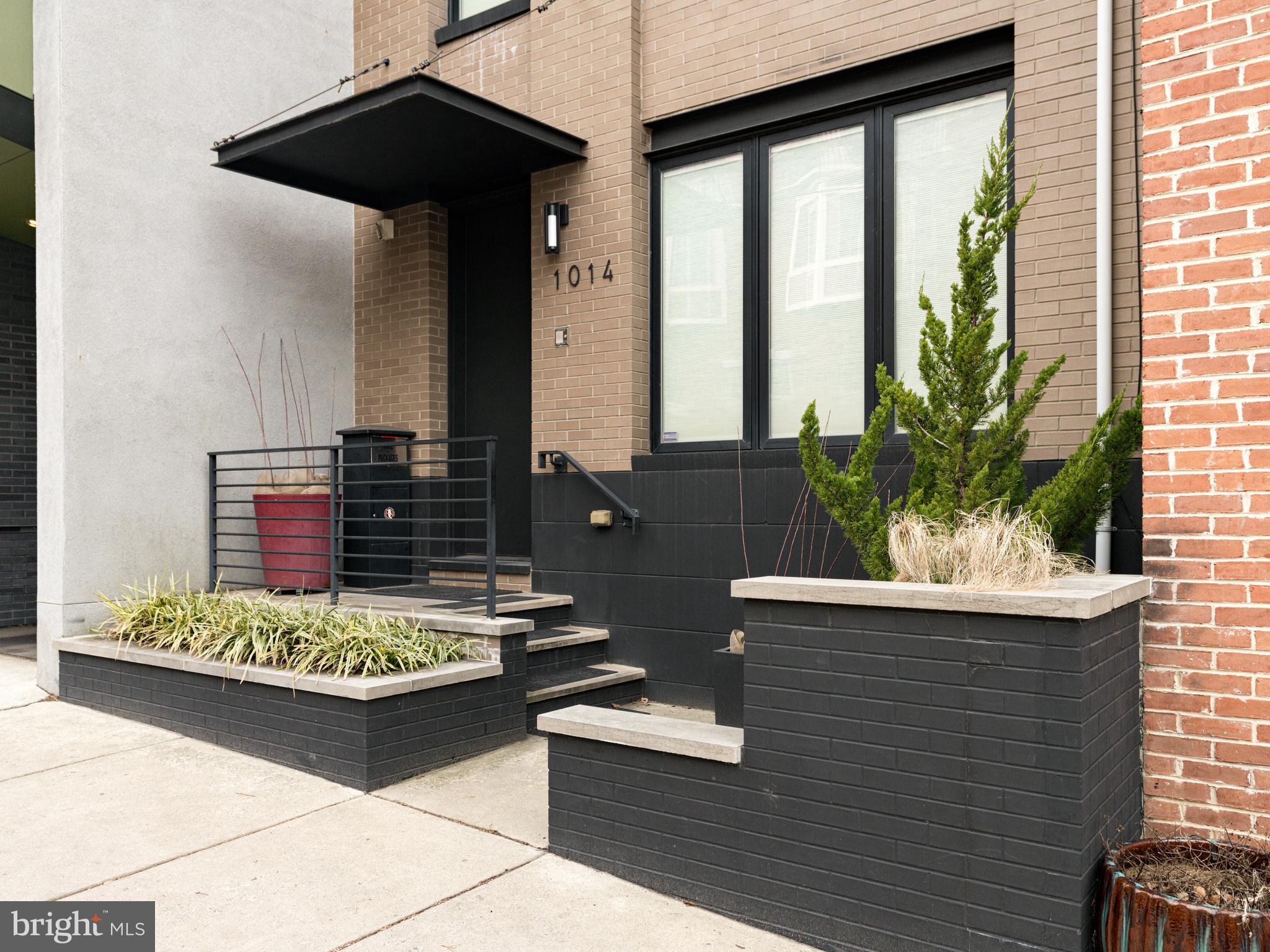 The BEST location in Northern Liberties! Situated just steps from Liberty Lands Park. This impressive 3-story residence, built by the well-known developer Callahan Ward, boasts three large bedrooms, three and a half bathrooms, exceptional curb appeal, and an expansive 3,500 square feet of living space. The property's 18 ft wide and 90 ft deep footprint is a rarity, providing exceptional layouts, space on every floor, and a huge yard. The entrance, which is recessed from the street, is beautifully enhanced by raised planting beds and a custom steel overhang protecting the front door threshold. Upon entering the first floor, find a spacious living room, accompanied by a kitchen featuring granite countertops, a full-size sink and a bar sink, and a 12 ft island that seamlessly connects to the dining area and great room. The chef kitchen has both extensive counter space and cabinetry plus all the upgraded appliances - five burner gas cooktop, double 30-inch oven (one is convection), wine cooler, new Bosch 800 series dishwasher, cookbook shelves, and both under and over cabinet lighting. The great room is versatile enough to serve as both a living room and a dining area and features a remote controlled gas fireplace with a timer and thermostat. Large glass panels, and a sliding glass door at the rear of the great room, highlight the 23 ft deep fully landscaped backyard; a custom gated fence provides street access. The open floorplan of the first floor and the yard are perfect for entertaining. Additionally, a conveniently located half bath on this level includes a floating vanity with storage. The second level features a private primary suite with a huge custom-built walk-in closet and a skillfully tiled bathroom, double vanity sinks, a large walk-in shower with two shower heads, a deep bubbler soaking tub with heated backrest plus a heated floor. This level also includes a generously sized second bedroom, a hall bath, and a laundry room complete with a washer and dryer. The third level provides both privacy and convenience, with a large bedroom, a tiled full bath, and a spacious loft area that is currently configured as a two-person home office with custom built-in desks and cabinetry. This space can easily be converted into a fourth bedroom. A sliding glass door at the far end of the loft provides access to a large deck with city views. The finished portion of the basement offers an additional 725 sq ft of living space. There is also a utility room with storage, a workbench, and utilities. Additional highlights of this remarkable home include Pella Designer Series windows and sliding glass doors throughout with built-in cellular shades, Energy Star appliances, two high-efficiency furnaces, a two-zone HVAC system, wood flooring, high ceilings, recessed lighting, a tray ceiling in the main bedroom, a switch-back stairway, custom handrails, and a remote-operated rain-sensitive Velux skylight for enhanced natural lighting. The property also offers a large tranquil backyard retreat, with a paver patio and camouflaged condensers, making it an ideal setting for relaxation. The outdoor spaces include the huge rear 3rd floor deck with views of Center City and a private balcony off the main bedroom. This magnificent property is less than 15 years young with high efficiency systems, including a brand new 75-gallon water heater. The seller is providing 1 year of covered parking in a secured garage less than two blocks away. This amazing home offers the city lifestyle, walkability to some of the best restaurants and cafes in the Northern Liberties and Fishtown area, easy access to public transportation, and only a short distance to Center City. This highly desirable property is easy to show so make your appointment today as this one simply will not last!