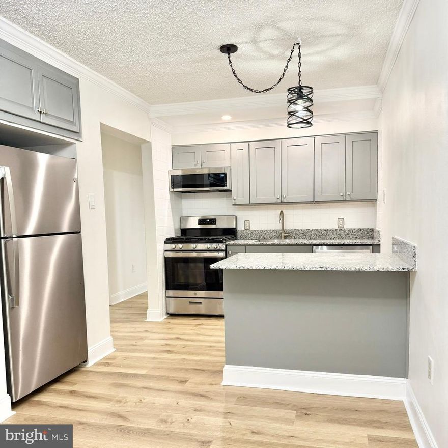 Welcome to the NEW and IMPROVED 400 Main #11! This STUNNING 2 bedroom unit has LOTS of upgraded features and is PET FRIENDLY! This newly renovated and freshly painted apartment has new installed lighting in all rooms, NEW luxury vinyl plank flooring throughout,  full size stainless steel energy-efficient appliances:  refrigerator, gas range with oven, microwave, dishwasher and a large kitchen island that adds more storage. The kitchen pantry could be its own room, it's so big! Newly installed energy-efficient mini-splits in kitchen/living room and both bedrooms, which offers personalized heating and cooling. The apartment has a stacked, washer and dryer. Private storage space in the basement and 2 off-street parking spaces in our private parking lot. All of this and more with an excellent Downtown Royersford location; minutes from Rt 422, 724, walking trails and area hotspots!  Non-smoking Building. Included Utilities: Trash, sewer, gas for cooking, water, common area maintenance and snow removal. Tenants pay ONLY electric and cable/wifi. Lux amenities include: pet friendly with low monthly fee, controlled parking lot, online rent payment, private storage units in basement, EV Charging stations in public lot across the street, walkable main street with restaurants, boutique shopping, coffee shop. Walking distance to the farmers market, the SRT and river access!