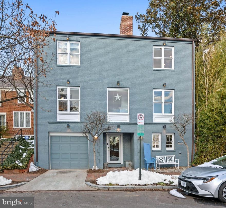 Experience unparalleled views, a stunning private patio with a Koi pond, and the convenience of an attached garage in this exceptional single-family home steps to all that Georgetown has to offer. The entry level includes an attached garage, a versatile bedroom or storage room, a laundry room, a convenient full bath adjacent to the luxurious sauna—a true delight! The main level features a gourmet chef's kitchen equipped with top-of-the-line stainless steel appliances, elegant quartzite countertops, and a spacious dining area. A large picture window offers a serene view of the private back courtyard.  Perfect for entertaining with a seamless connection to the dining room. The expansive family room is highlighted by a wood-burning fireplace and oversized windows, creating a warm and inviting atmosphere. This level also includes a versatile bedroom/office/den and a powder room. Throughout this sun-drenched home, you'll find two fireplaces, oversized windows, recessed lighting, and beautiful hardwood floors.
 
The upper level is dedicated to the primary suite, which features a cozy wood-burning fireplace, a cedar walk-in closet, and an en-suite bath. The second bedroom, originally two separate rooms, can easily be divided again. Built-in bookshelves, a second cedar walk-in closet, and an office area add a special touch to this space. Another full bath completes the third level. The private, hardscaped back patio is an entertainer's paradise, complete with a koi pond and waterfall feature. Additional features include off-street parking, an attached garage, and extra storage space.

Located across from the grounds of The Duke Ellington School of the Arts and within the boundaries of Hyde-Addison Elementary School, Hardy Middle School, and MacArthur High School, this home offers the perfect blend of luxury and convenience. Enjoy the vibrant lifestyle of Georgetown right at your doorstep in this exceptional home.