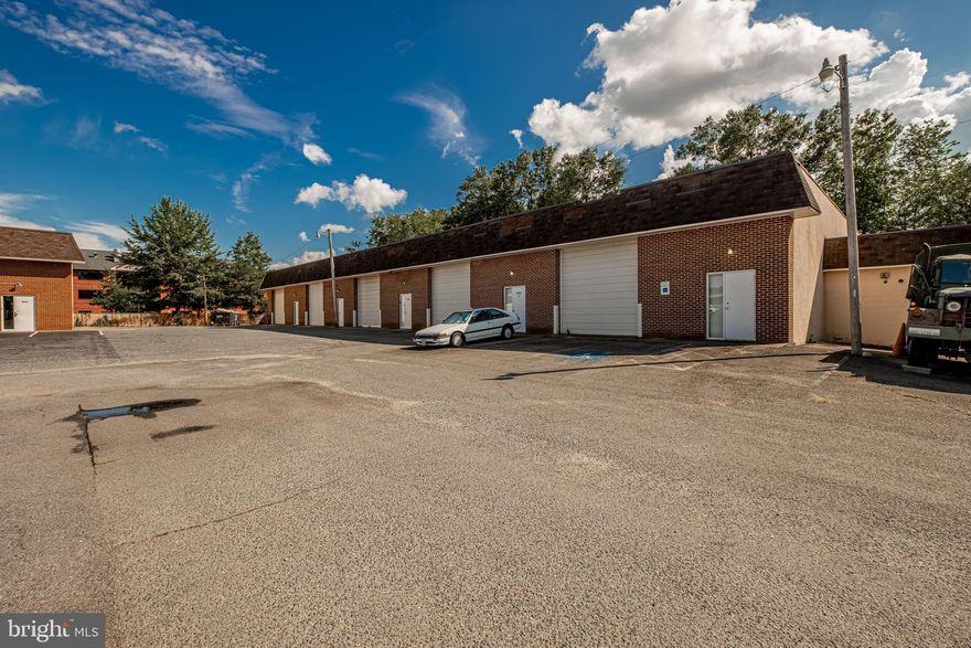 1,800 SF +/- End Cap Warehouse Unit Within Gough Industrial Park with Direct Access to Leonardtown Road (MD Route 5). Open Warehouse w/ One Private Restroom. Oil Heat, No AC. 12 FT Drive-In Overhead Door.  15' 6" CLEAR Ceiling Height. Annual $400 CAM Fee. Tenant Responsible for ALL Utilities & Trash. Fenced Yard Space Available for Additional Cost Upon Request. NO AUTOMOTIVE USES (Per Owner Due to Exclusivity Clause w/ Existing Tenant).