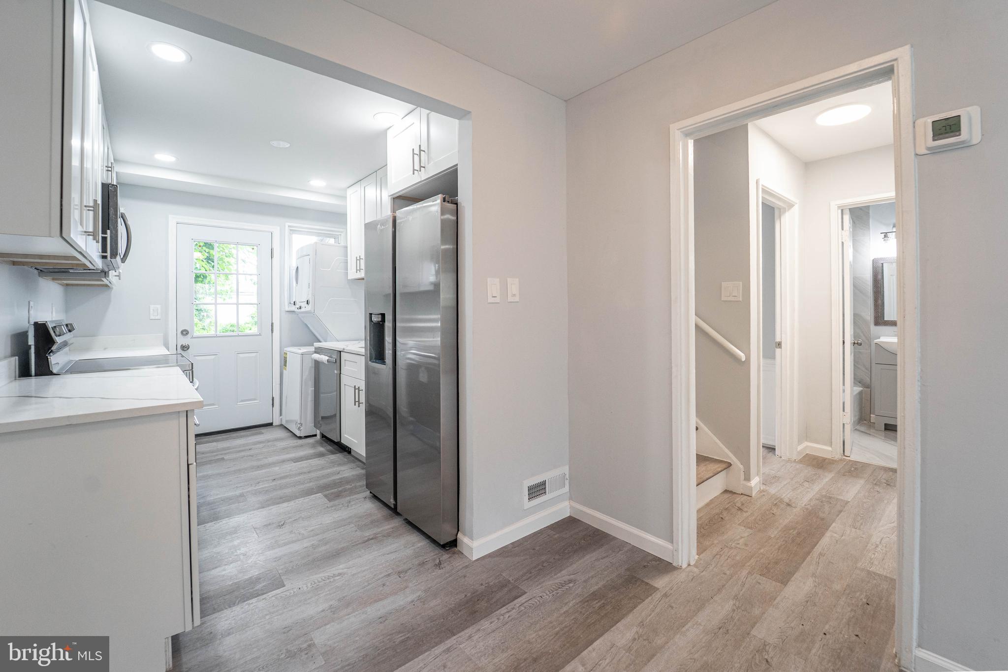 With 100% Financing, No Downpayment, $5,000 Grant, and at least a 620-credit score, You’ve Found Your Home at 7708 Bender Rd, Landover, MD 20785! This home checks every box—updates, layout, location, and value at 4 Bedrooms | 2 Bathrooms | 2 Levels | Fully Renovated | Turnkey Ready.
All the bells and whistles of a luxury renovation—without the luxury price tag—and located just steps from the Prince George's County Landover Police Station for added peace of mind.
This fully redone 4-bedroom, 2-bath home is move-in ready with new everything:
New roof
New HVAC
New LVP floors
New light fixtures
New bathrooms
New kitchen
New washer & dryer
New ceiling fans
The heart of the home is the sleek galley kitchen with 42" white soft-close cabinets, quartz countertops, stainless steel appliances, upgraded hardware, and a walkout to your fenced backyard—perfect for entertaining or relaxing.
The main level features an open-concept living/dining area, two bedrooms, and a full bath. Upstairs offers two more bedrooms with a buddy bath between them—perfect for privacy and function. Extra storage space is available in the backyard, and there’s street parking in front. Fenced front and back yard.
Location perks:
Walk to Prince George’s County Police Department (Division III)
6 minutes to Landover Metro
10 minutes to MARC Train
2-minute walk to Metrobus at Matthew Henson Ave & Barlowe Rd
25 minutes to Reagan National Airport
Don’t miss your chance to make it yours.